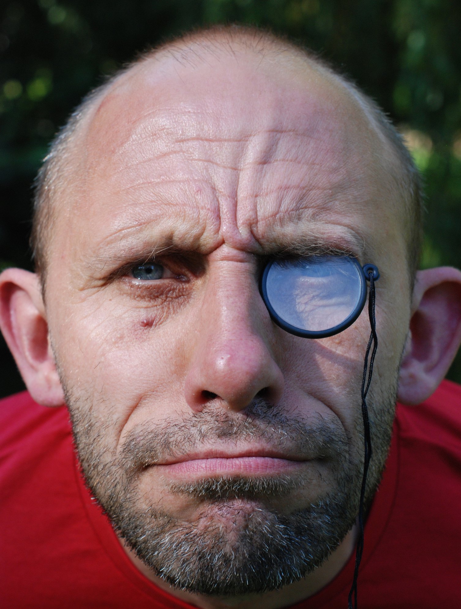 Portrait of a straight-faced man wearing a monocle. | Photo: Getty Images