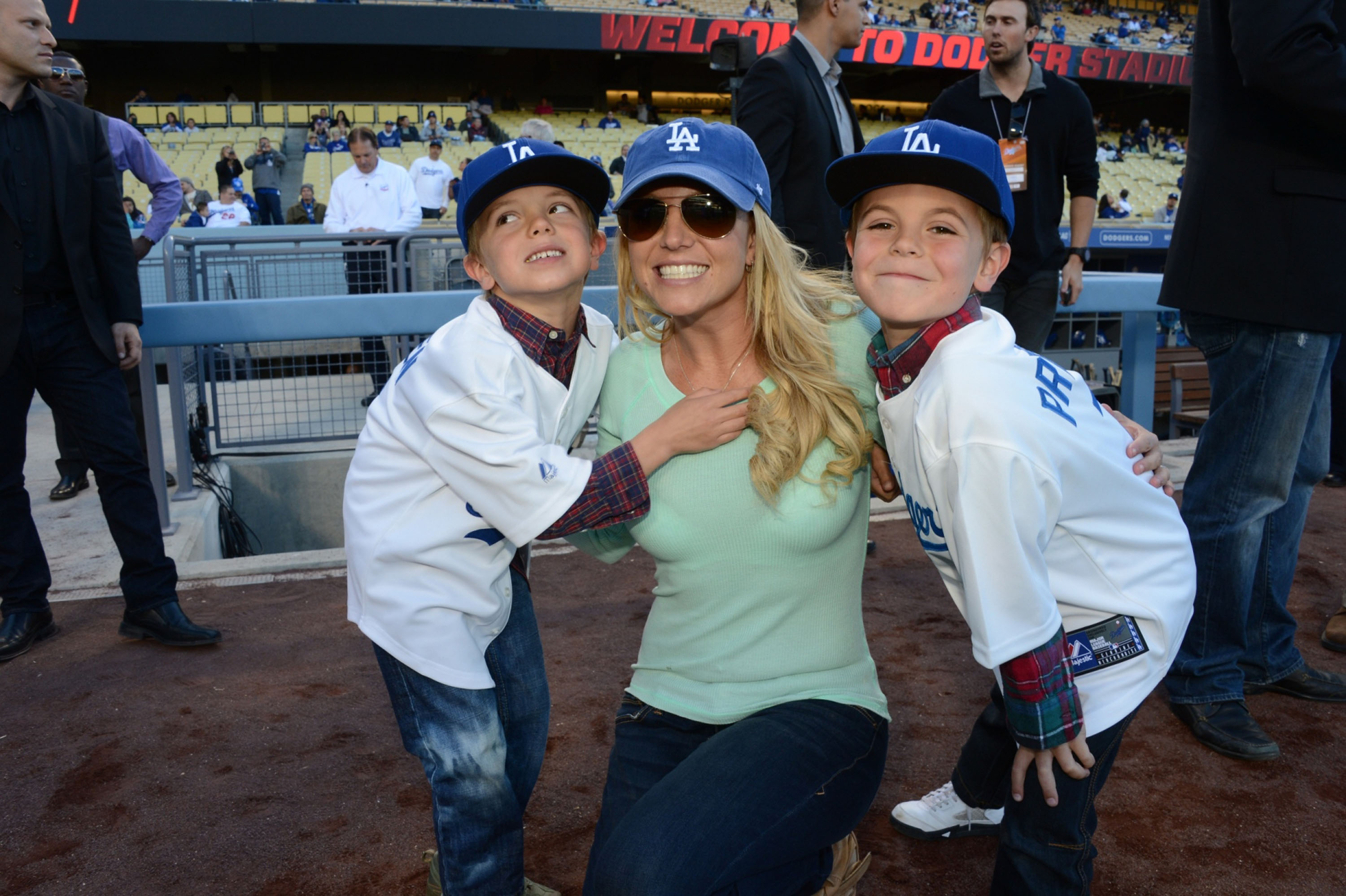 Britney Spears poses with sons Jayden James Federline (L) and Sean Preston Federline (R) at Dodger Stadium on April 17, 2013 in Los Angeles, California. | Source: Getty Images
