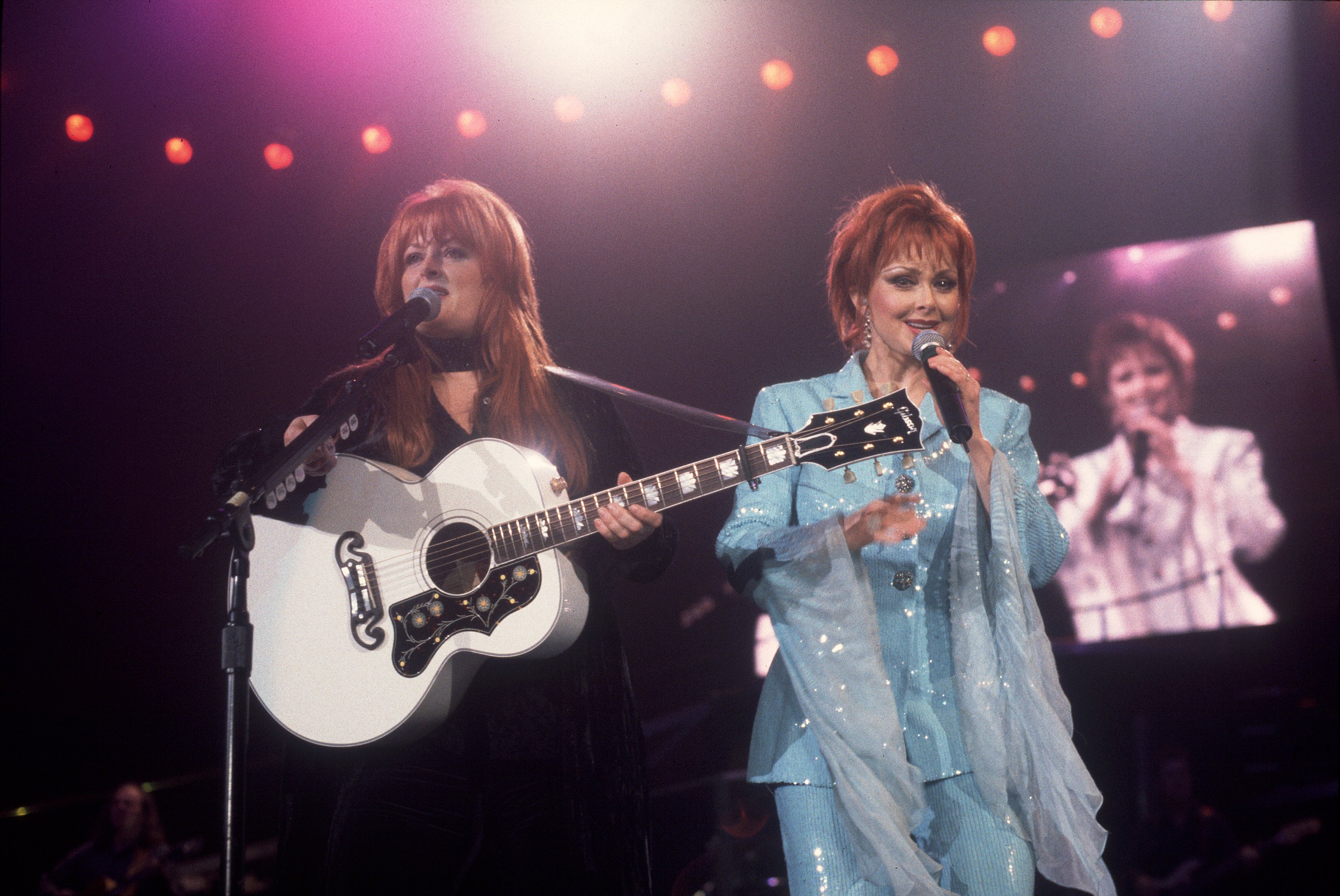Country music duo the Judds, with Wynonna Judd and her mother Naomi, perform onstage at the Rosemont Horizon in Rosemont, Illinois, on February 1, 1991. | Source: Getty Images