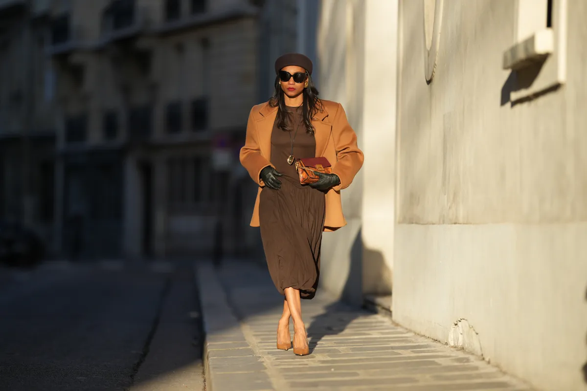Emilie Joseph wearing a camel coat during a street style photo session, on January 03, 2026 in Paris, France. | Source: Getty Images