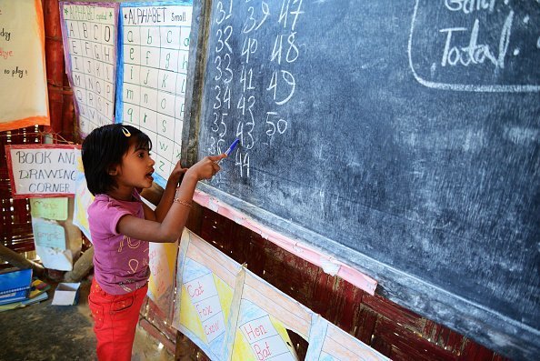 A young child studying in a school | Photo: Getty Images