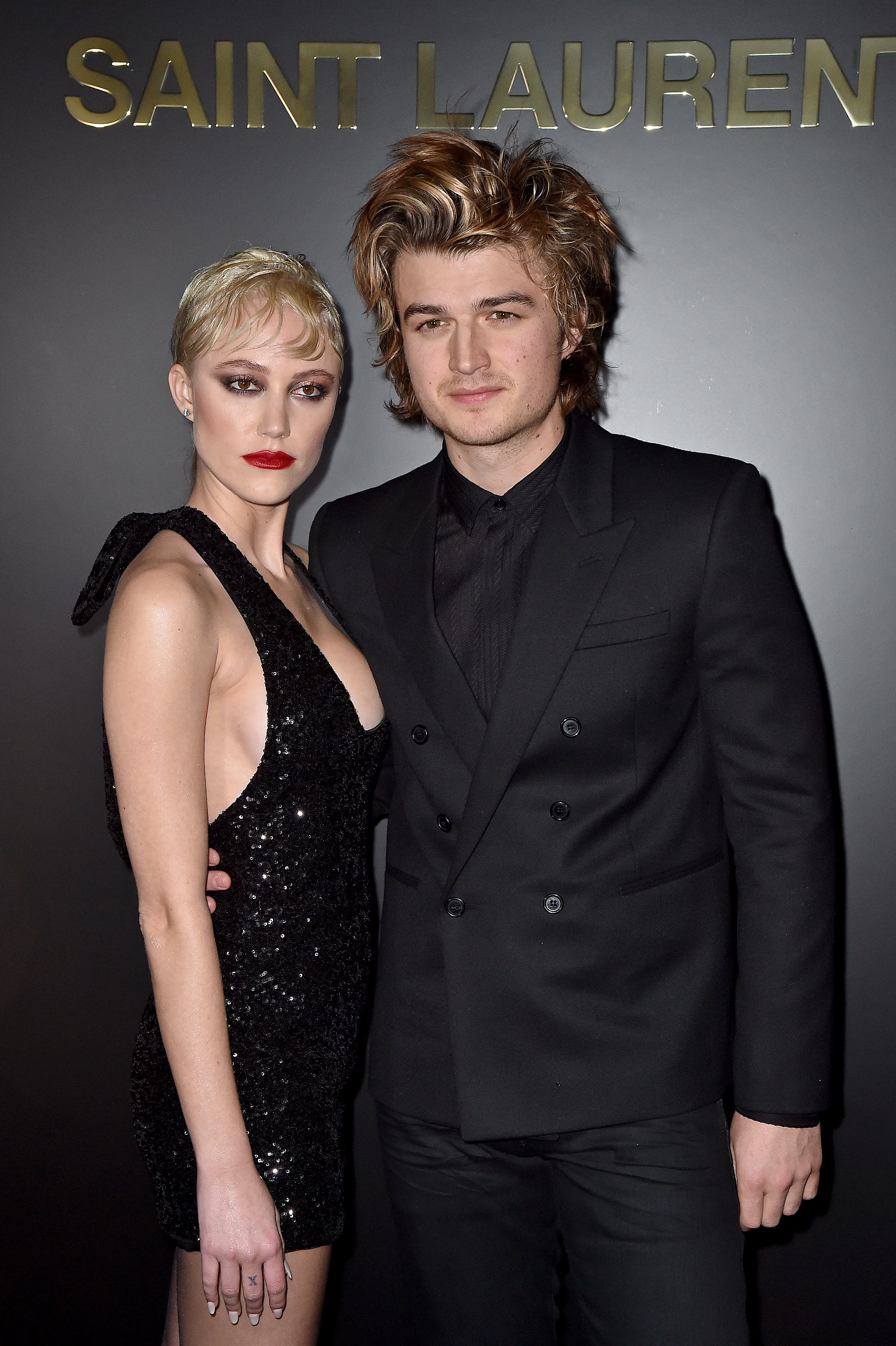 Joe Keery and Maika Monroe attend the Saint Laurent show of the Paris Fashion Week on February 25, 2020, in Paris, France. | Source: Getty Images