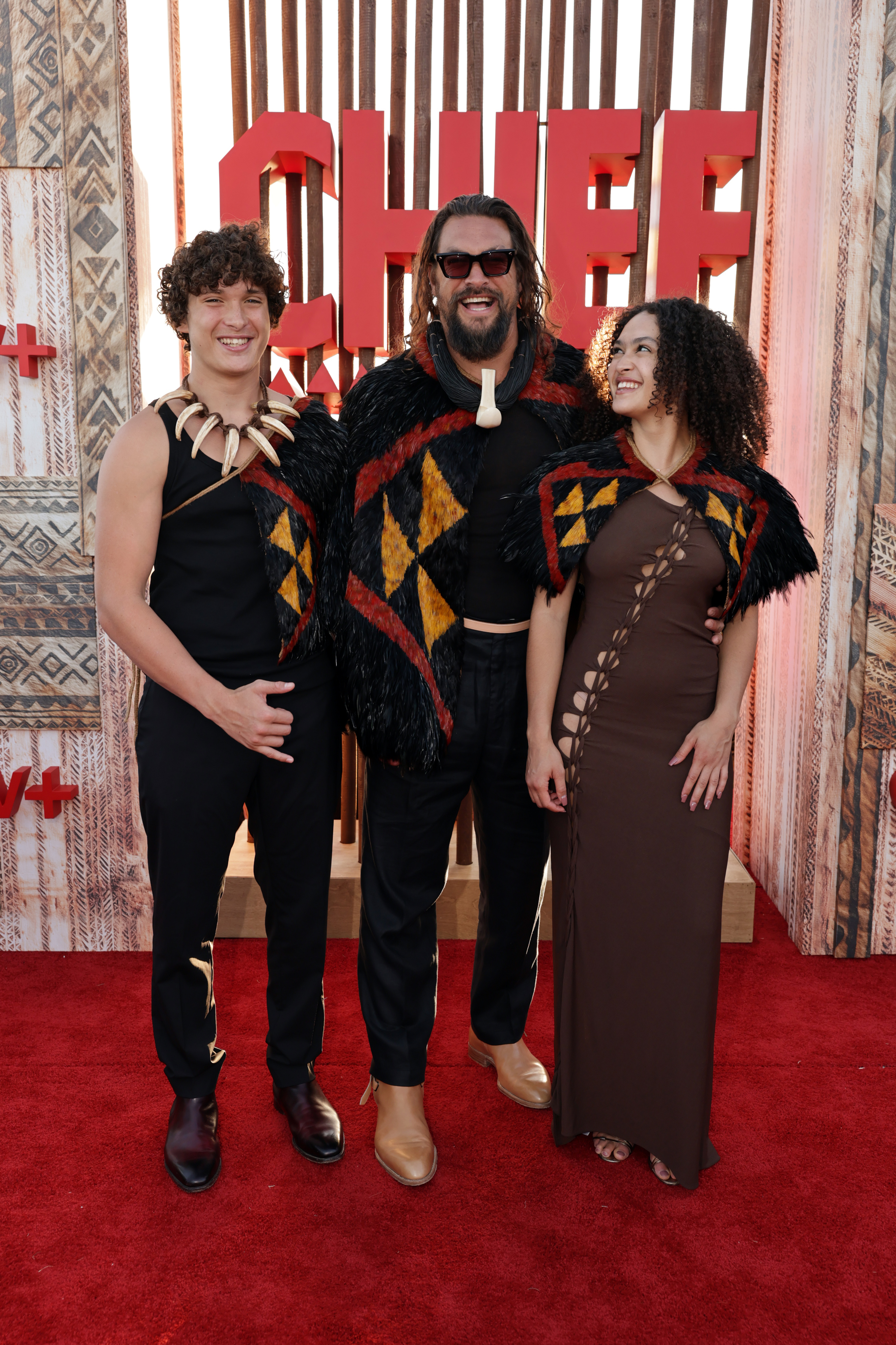 Nakoa-Wolf Momoa, Jason Momoa, and Lola Iolani Momoa seen at the world premiere of the Apple TV+ series “Chief of War” at the Ko Olina Beach Park on July 18, 2025, in Kapolei, Hawaii. | Source: Getty Images