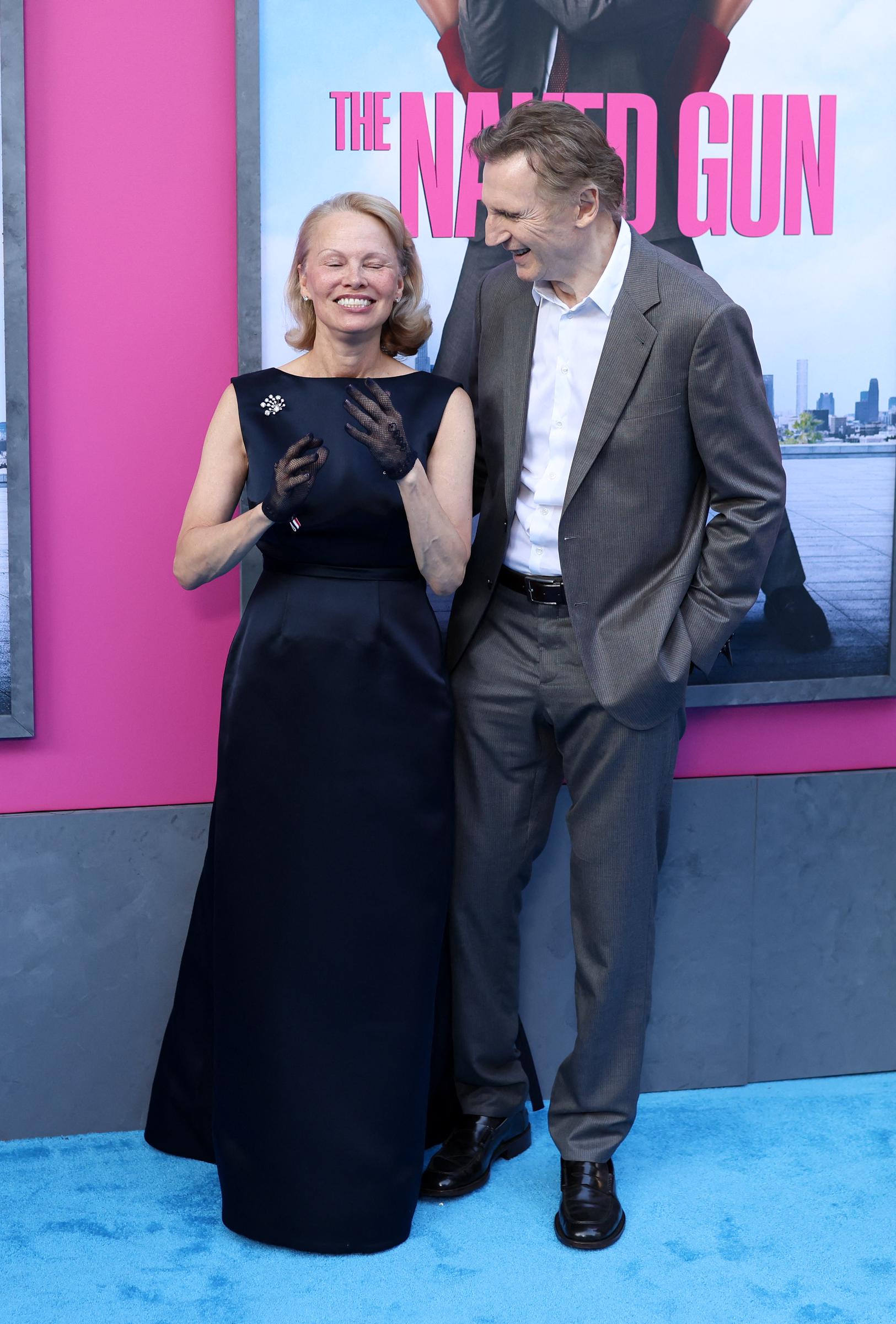 Pamela Anderson and Liam Neeson at the New York premiere of "The Naked Gun," 2025 | Source: Getty Images
