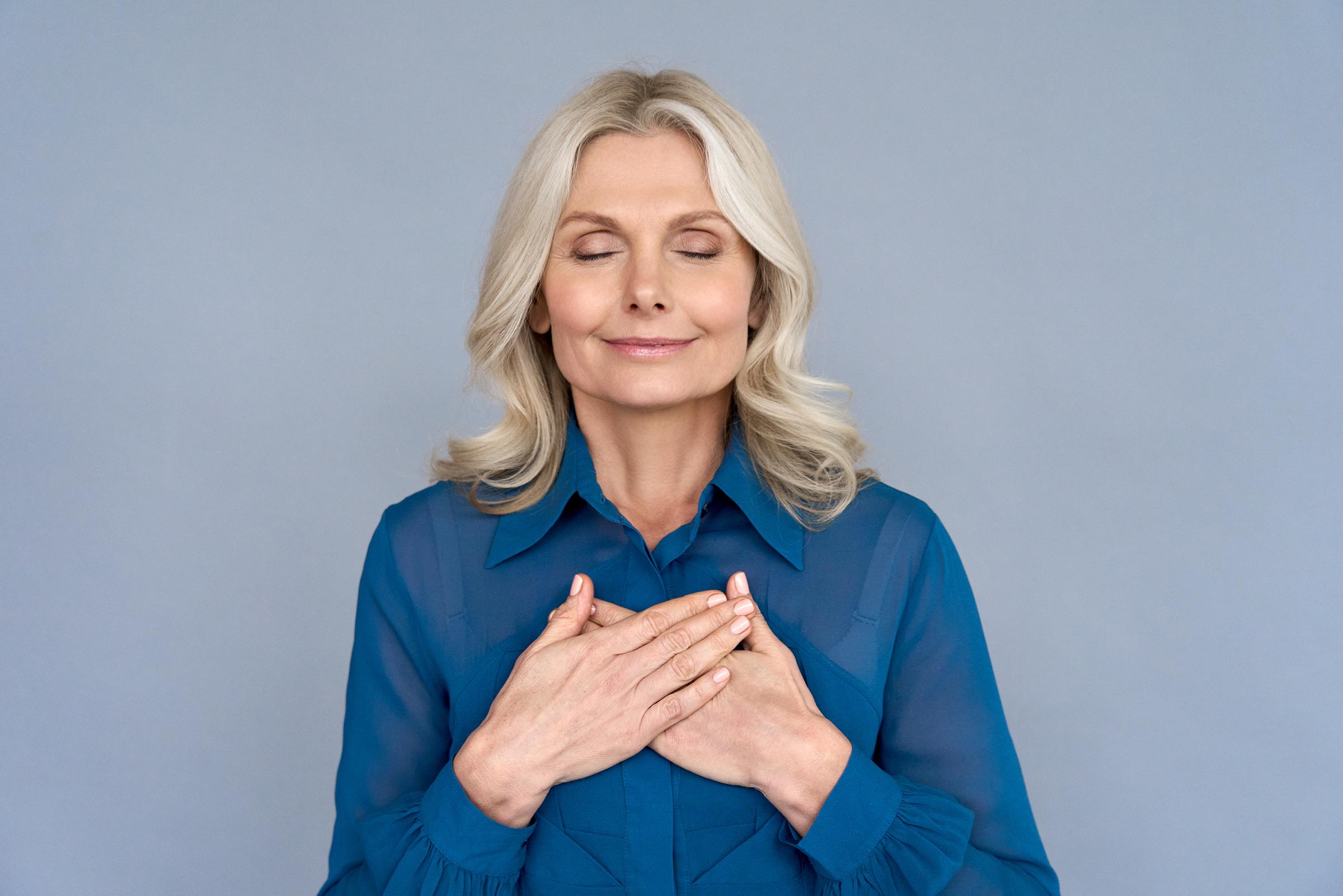A woman enjoying a quiet moment of gratitude | Source: Shutterstock