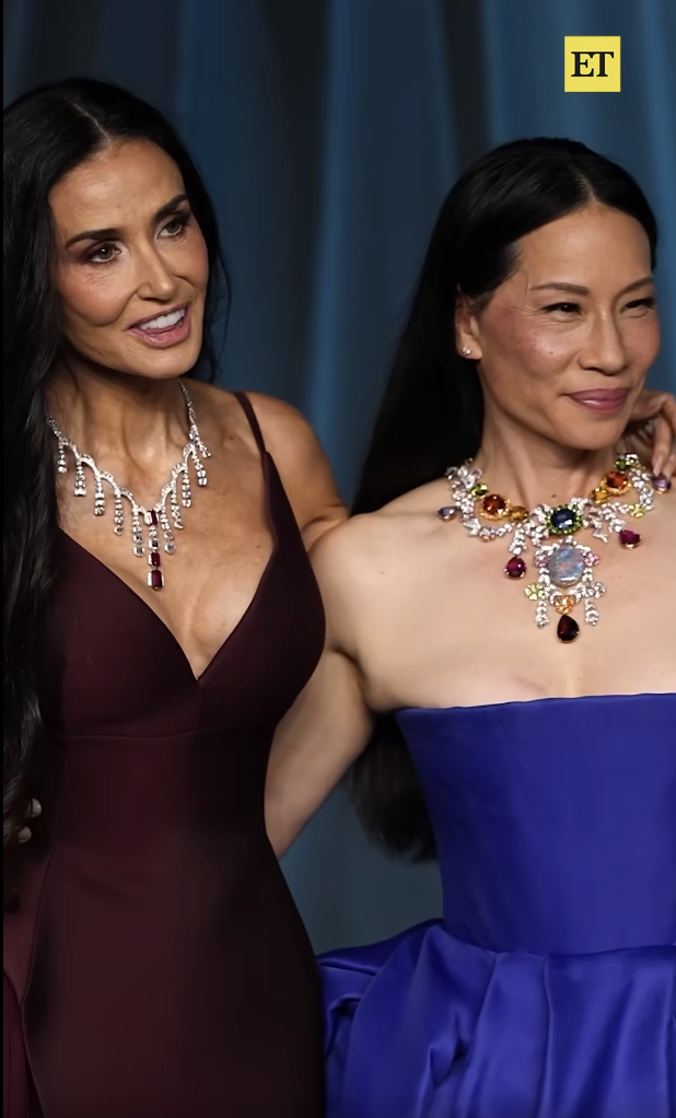 Demi Moore shares the spotlight with Lucy Liu, the two actresses beaming as they pose arm-in-arm. Their contrasting gowns and radiant smiles made this moment a standout on the red carpet. | Source: Facebook/EntertainmentTonight