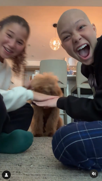 Sophia and Isabella Strahan with their dog in a video, dated May 2024. | Source: Instagram/michaelstrahan
