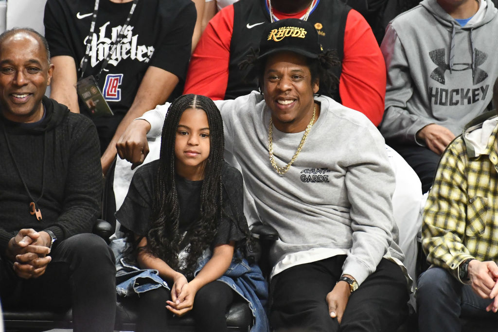 Blue Ivy Carter, 8, wore a black t-shirt and had long, braided hair. She was seated next to her father, Jay-Z, while attending a basketball game between the Los Angeles Clippers and the Los Angeles Lakers at Staples Center on March 8, 2020, in Los Angeles, California.