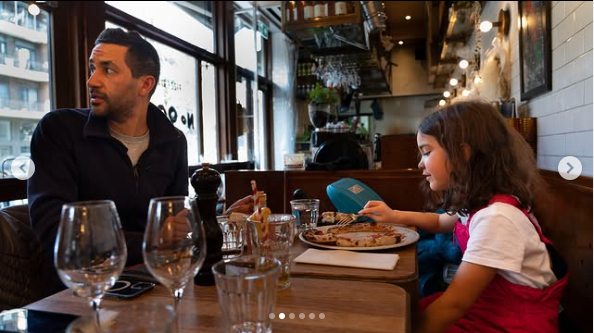 A photo of Luciano Frattolin and his daughter Melina Frattolin enjoying pizza taken from a post dated March 2, 2023 | Source: Instagram/lucianofrattolin