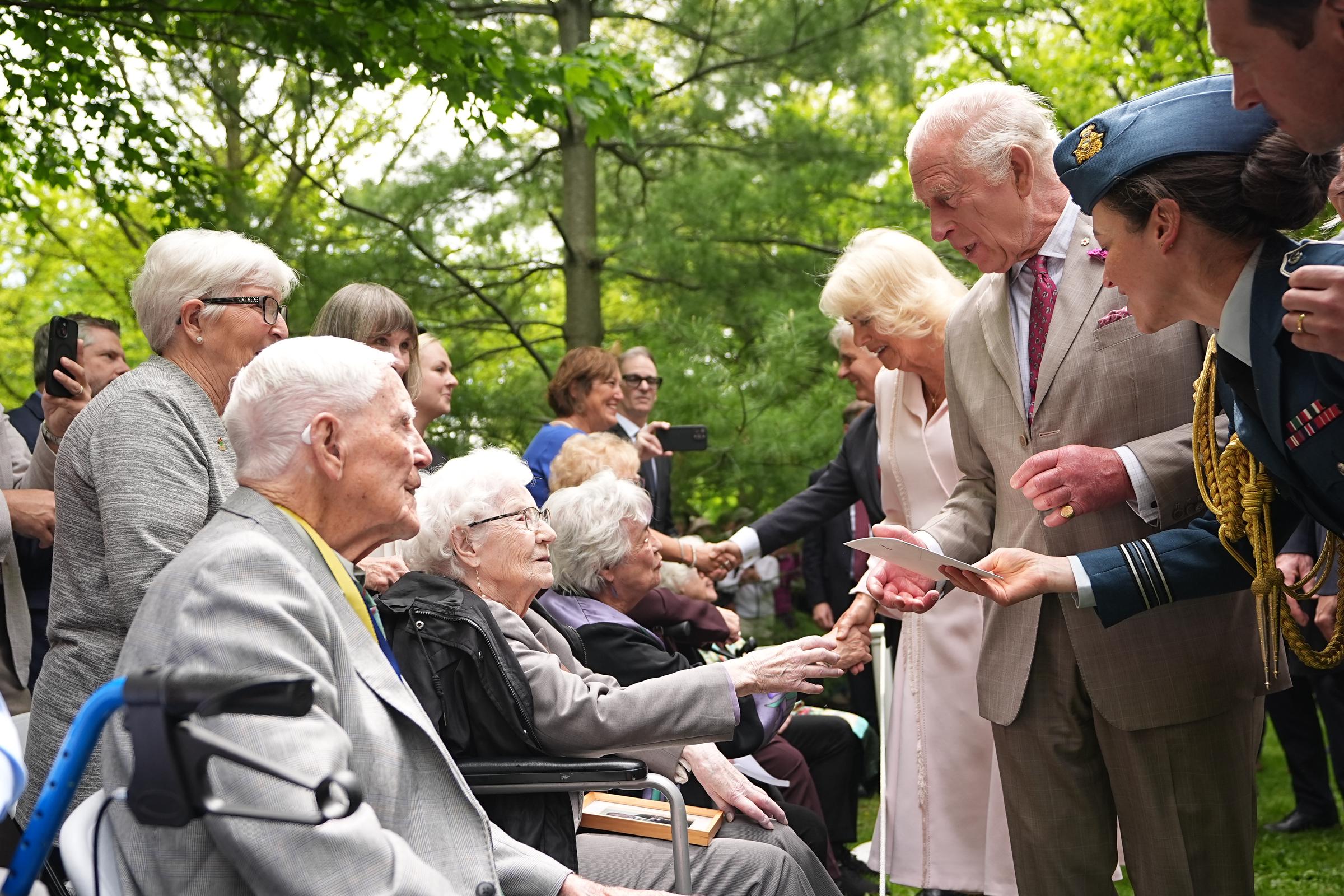 During the tree planting ceremony at Rideau Hall, King Charles III and Queen Camilla meet Richard Maxwell, 99, 100-year-old Betty Sinnett, and Carol Shipley, 89, in a heartwarming moment of connection across generations.