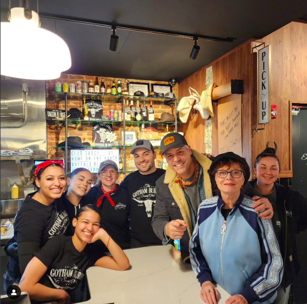 Susan Sarandon posing with the staff of Gotham Burger Social Club posted on January 23, 2024 | Source: Instagram/gothamburgersocialclub