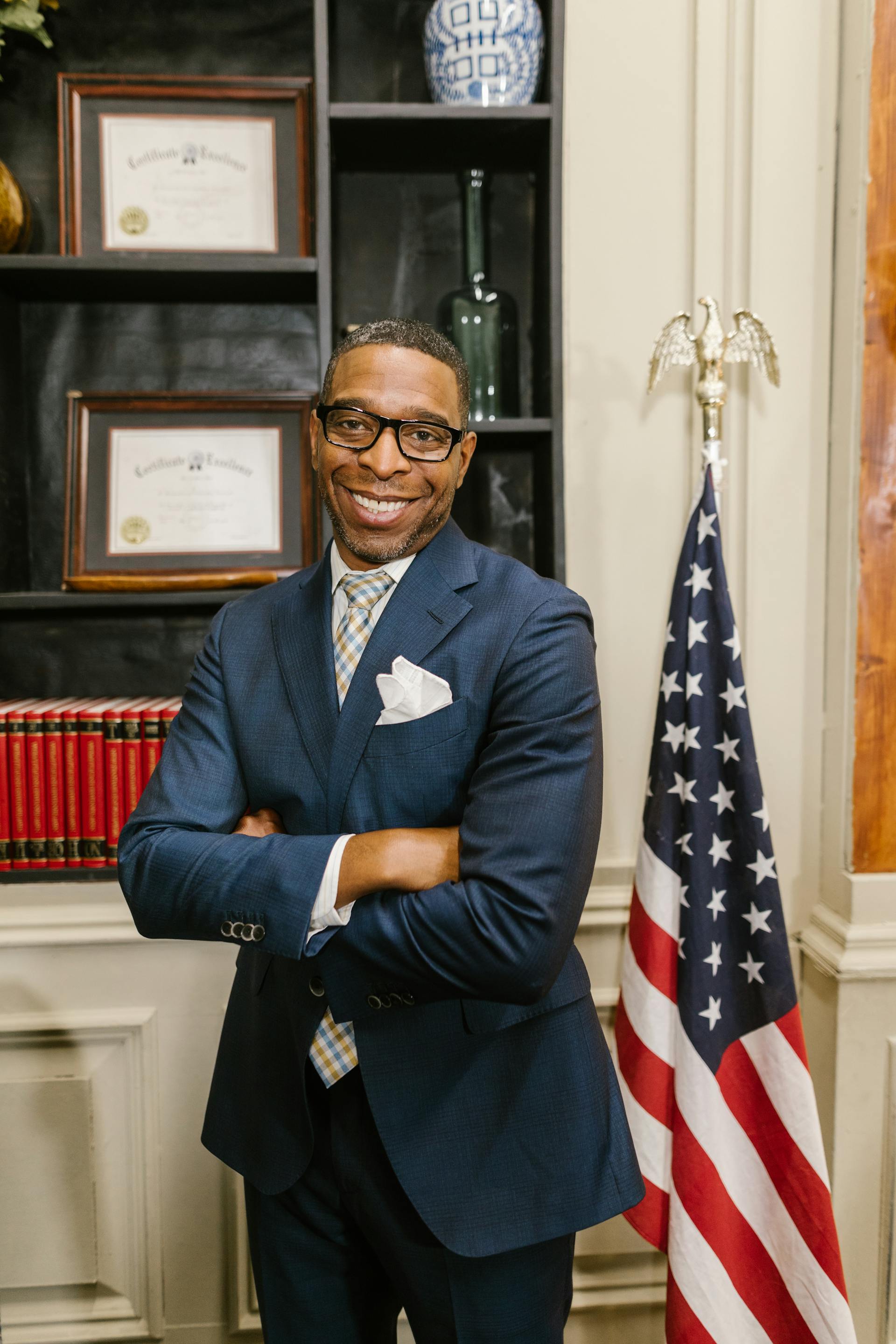 A lawyer standing in his office | Source: Pexels