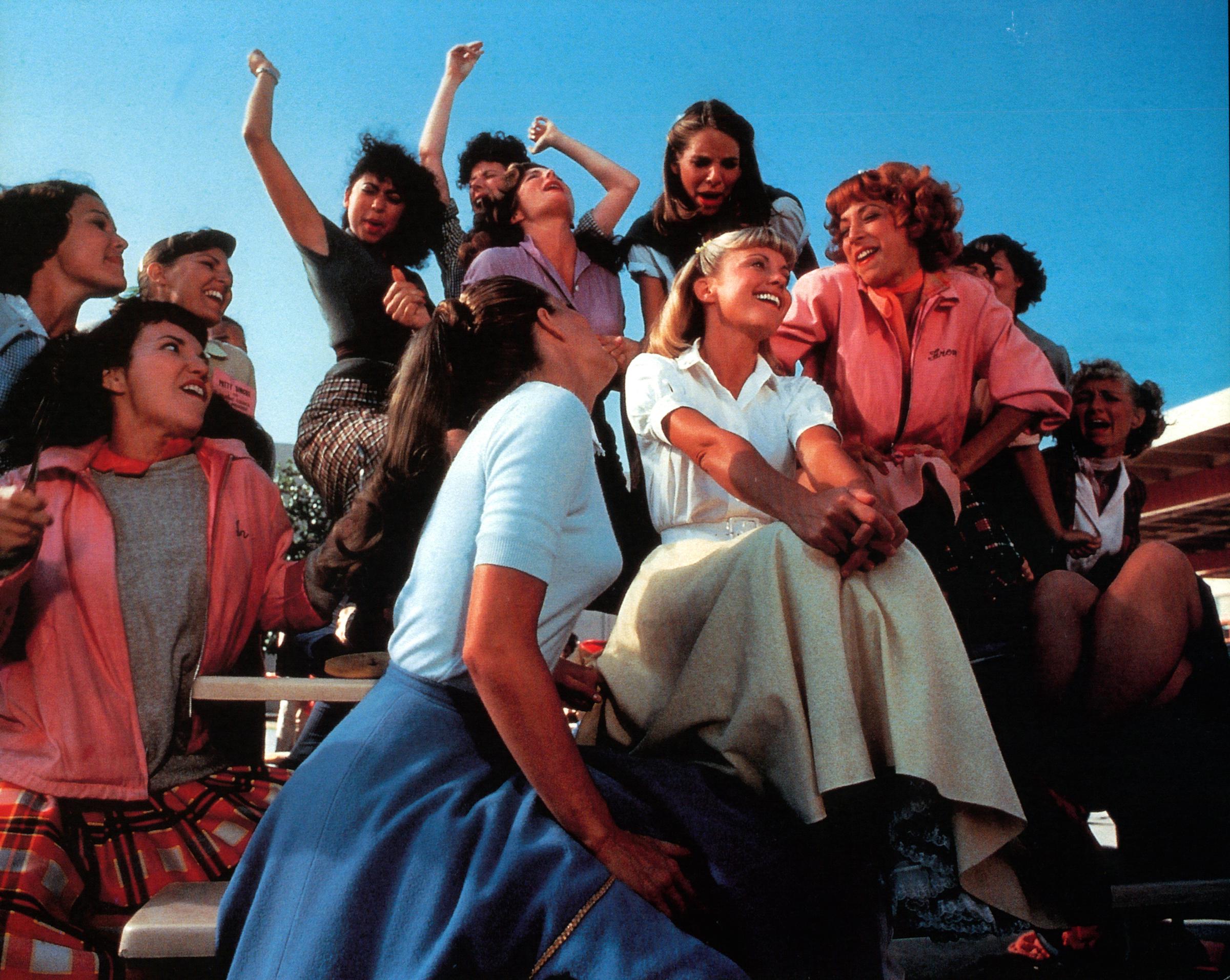 Olivia Newton-John and Didi Conn along with co-stars on the set of "Grease," 1978 | Source: Getty Images