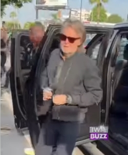Paul McCartney stepped out of a black vehicle with an easy smile, greeting onlookers as he arrived for his performance. Wearing dark sunglasses and a casual zip-up jacket, he exuded a laid-back confidence, while his longer hair and fuller grey beard marked a noticeable shift from his earlier, more polished appearance. | Source: Facebook/IWMBuzz