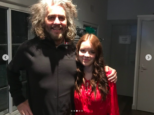 Wayne Coyne and Nell Smith posing for a picture, posted on October 7, 2024 | Source: Instagram/mrsimonraymonde