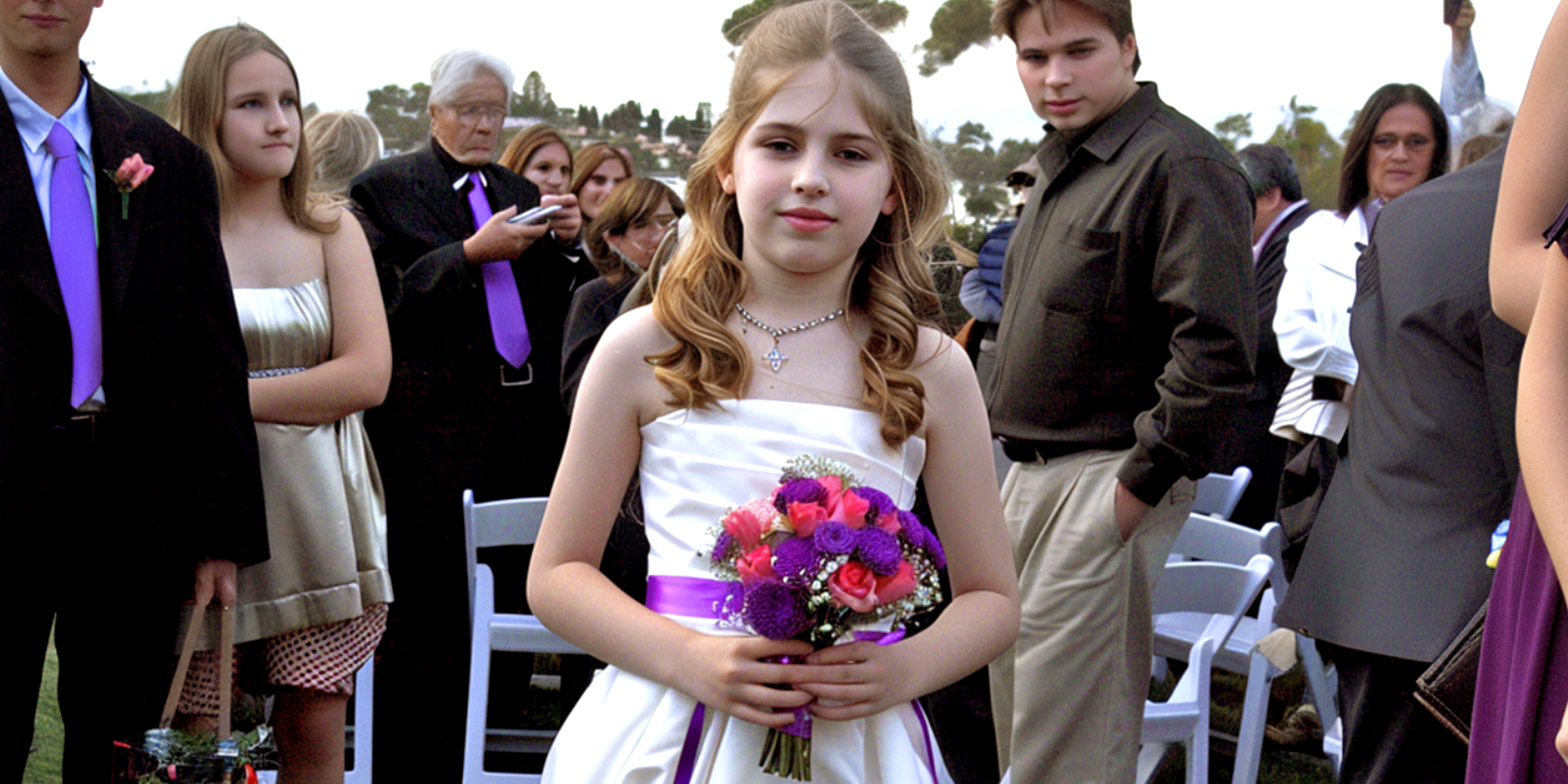 A flower girl walking down the aisle | Source: AmoMama