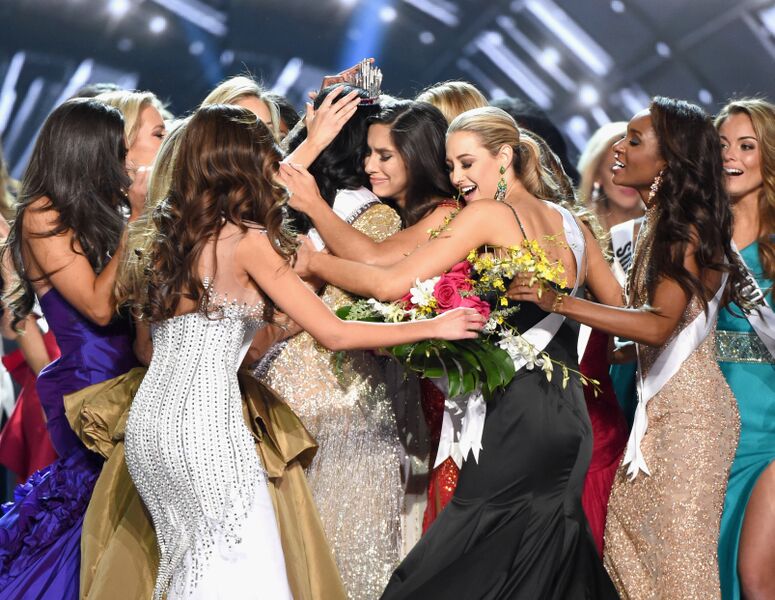 A powerful photo of beauty queens giving support to the crowned queen | Source: Getty Images/GlobalImagesUkraine