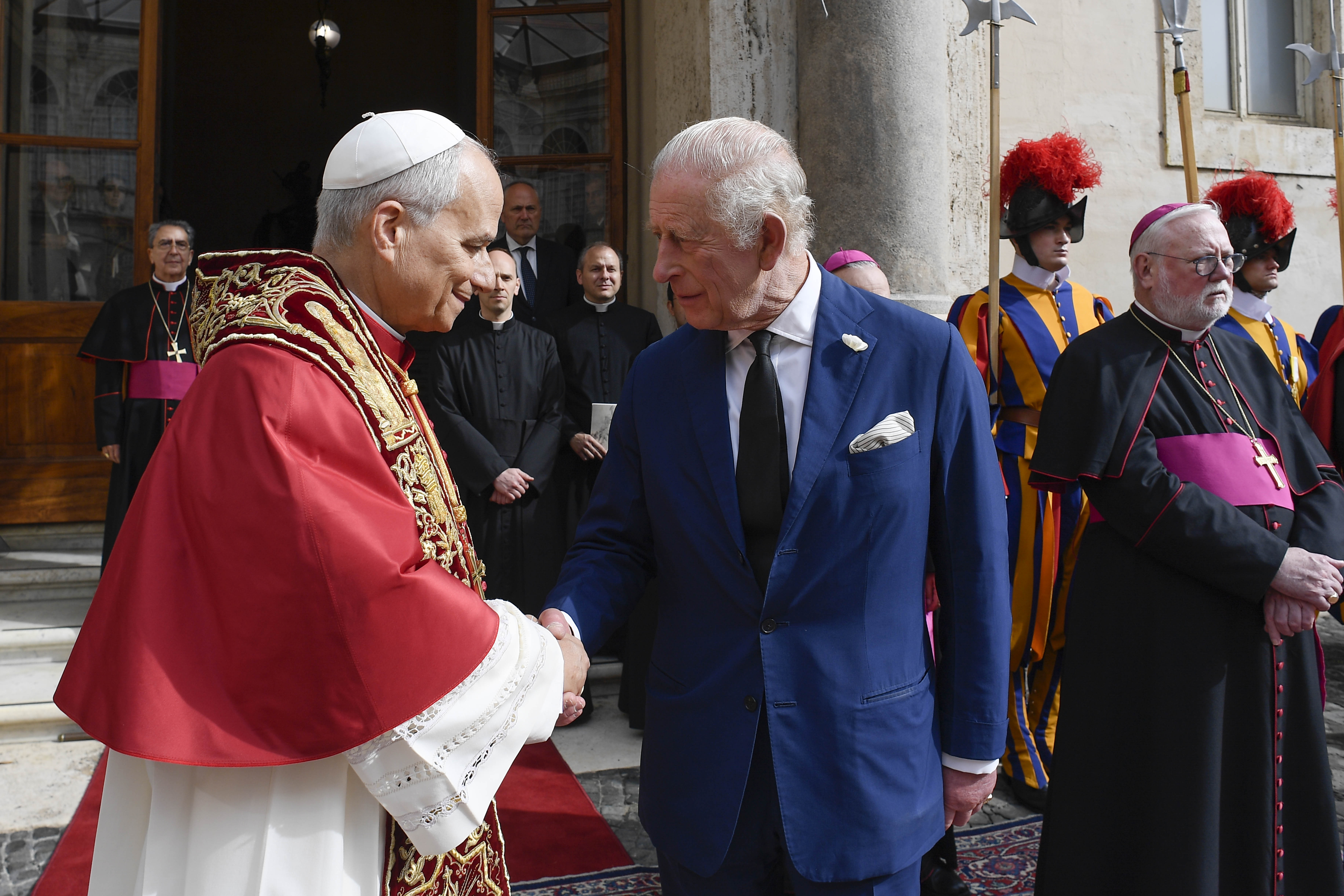 Pope Leo XVI shales hands with King Charles III as they leave the Apostolic Palace on October 23, 2025 | Source: Getty Images