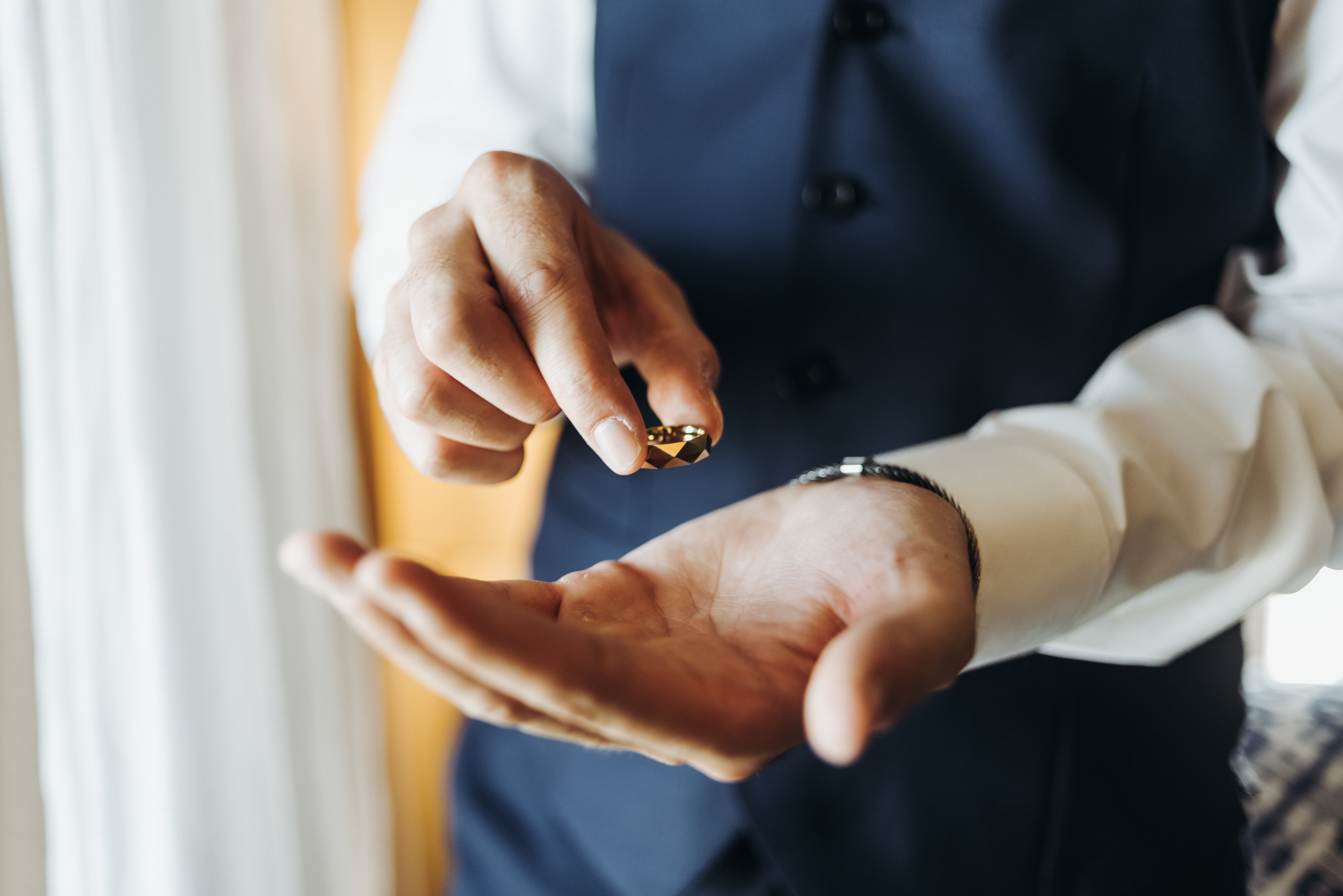 A man placing a ring on his hand | Source: Freepik