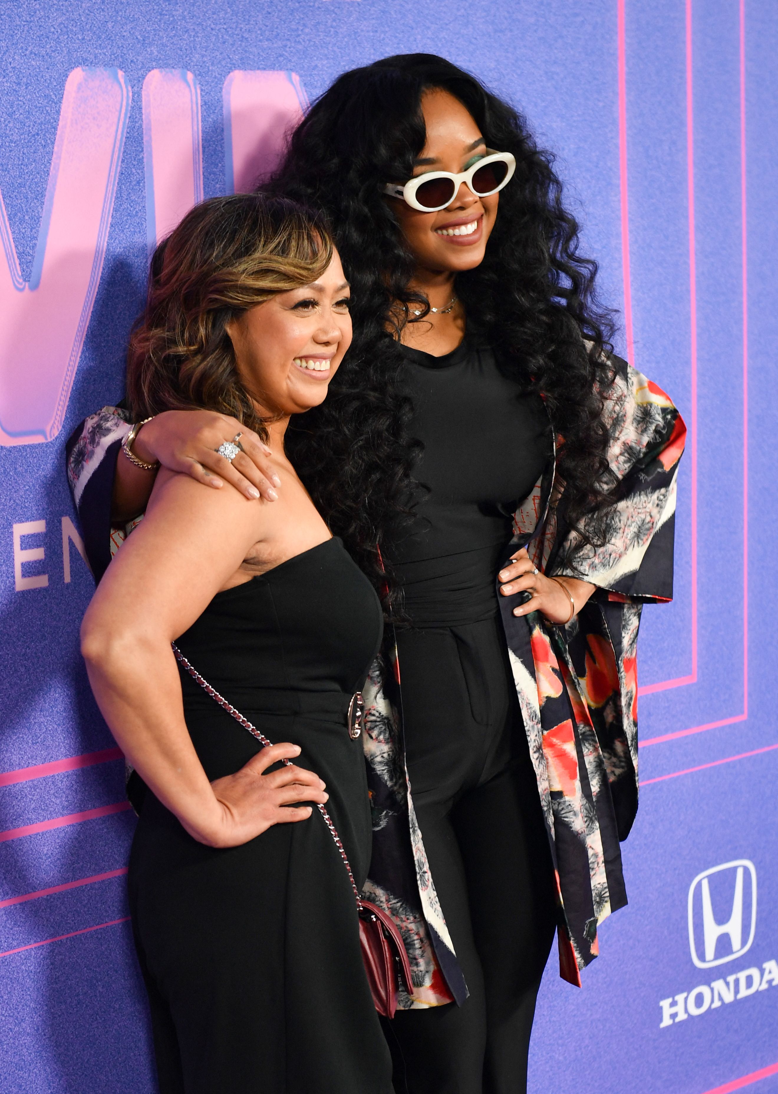 US singer-songwriter H.E.R. and her mother Agnes Wilson at SoFi stadium in Inglewood, California, March 2, 2022. | Source: Getty Images