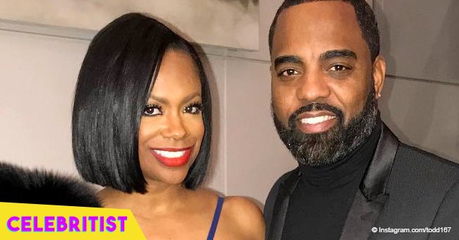 Kandi Burruss & husband warm hearts in pic with matching outfits in front of their restaurant