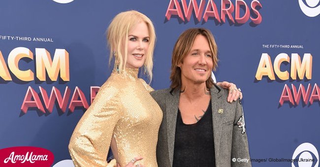 Nicole Kidman dazzles in a revealing gold dress as she joins Keith Urban at the ACM Awards 