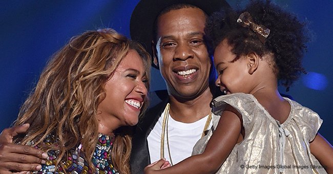 Blue Ivy plays with little brother Sir while on vacation with Beyoncé and Jay-Z