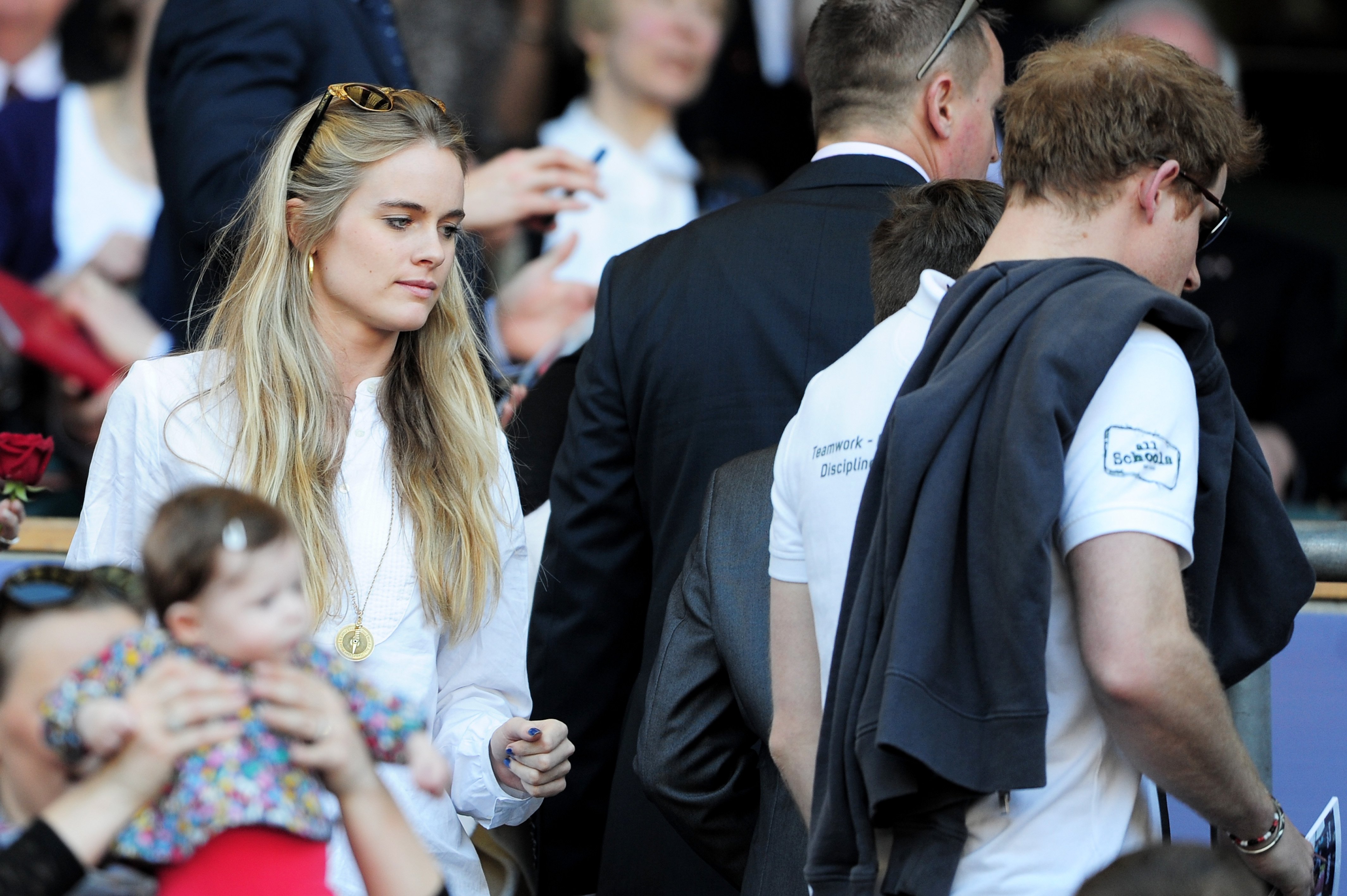 Prince Harry and Cressida Bonas about to take their seats during the RBS Six Nations match between England and Wales on March 9, 2014 in London  | Source: Getty Images
