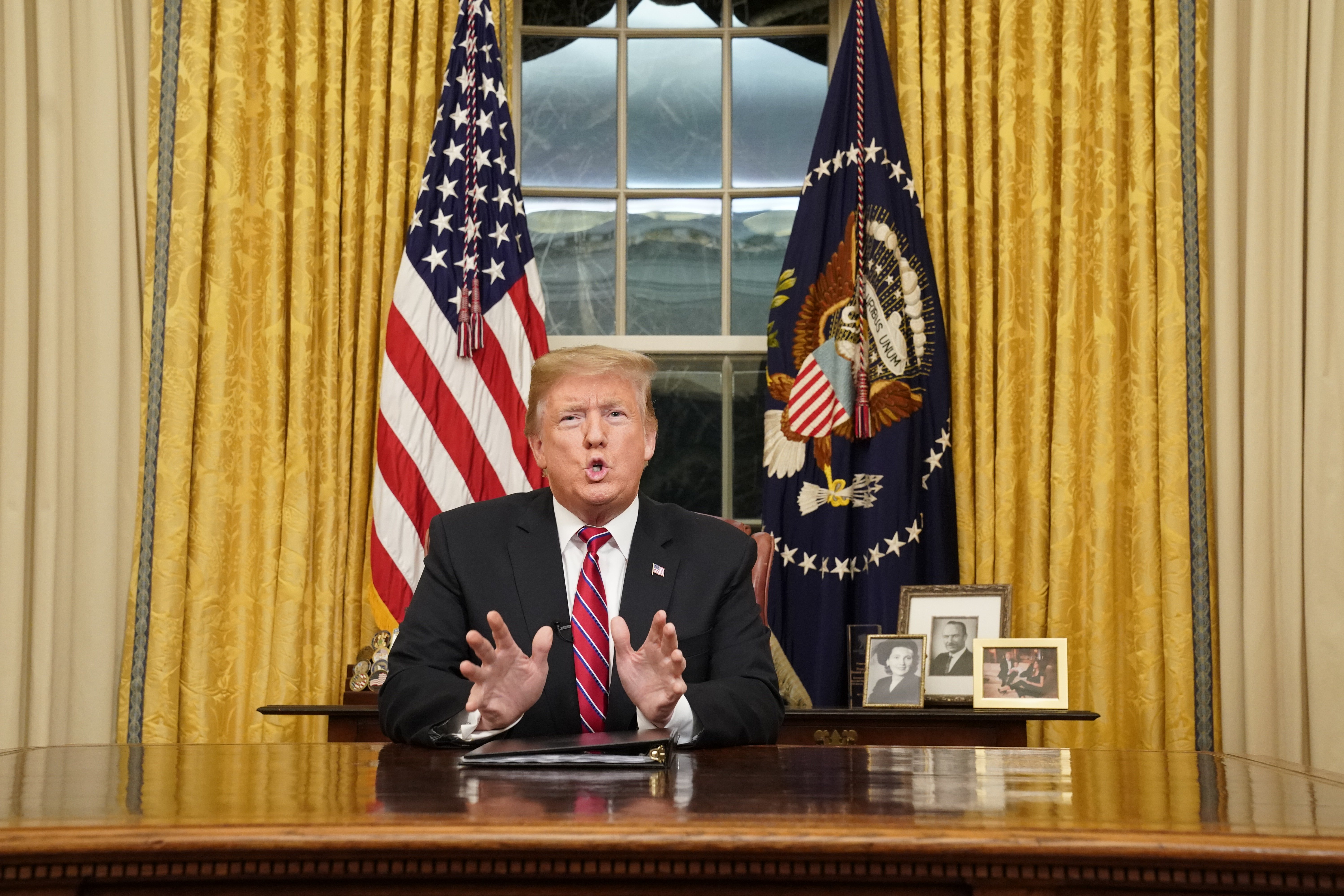 Donald Trump speaking to the nation in his first-prime address from the Oval Office of the White House | Photo: Getty Images