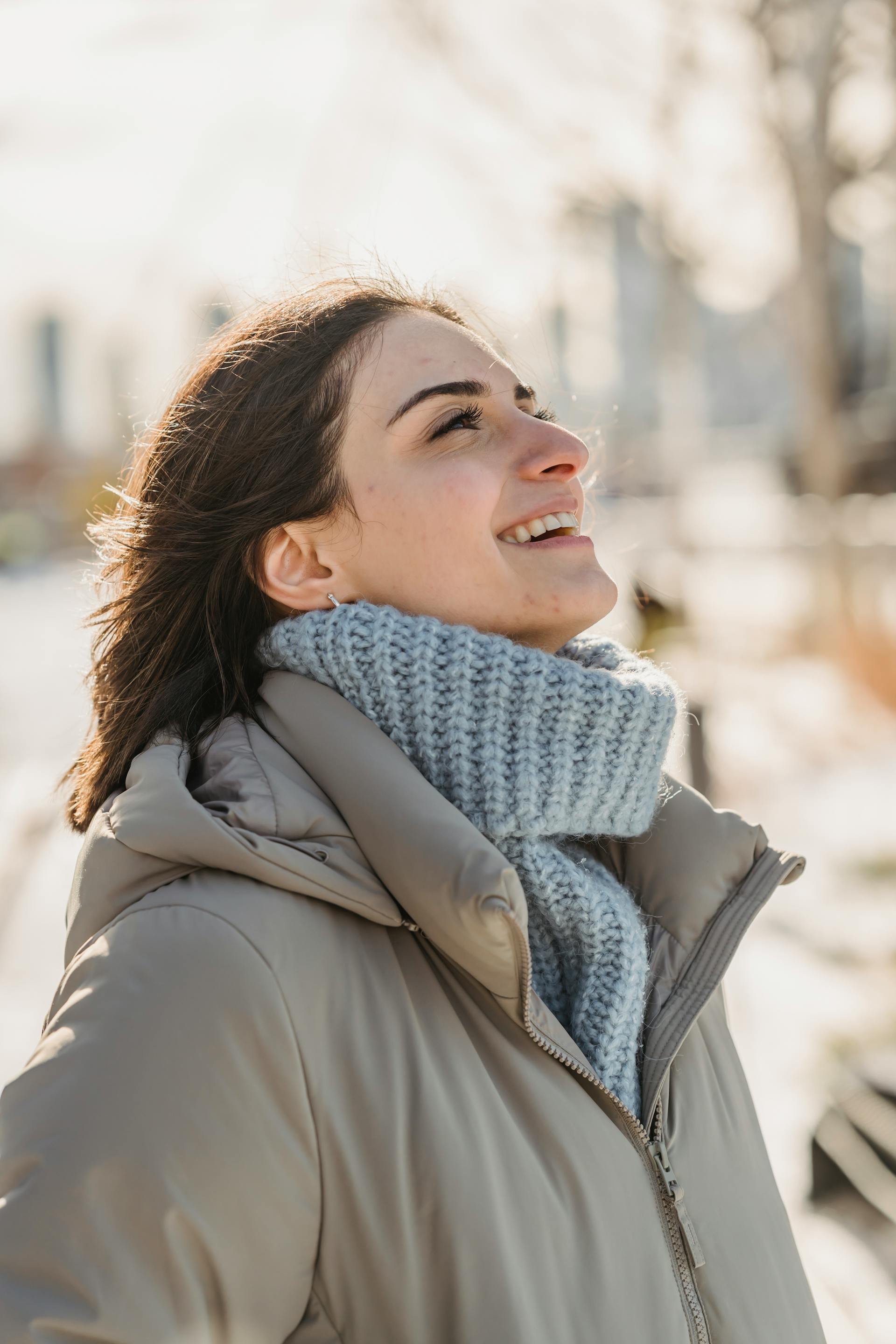 Happy woman smiling on a snowy day | Source: Pexels