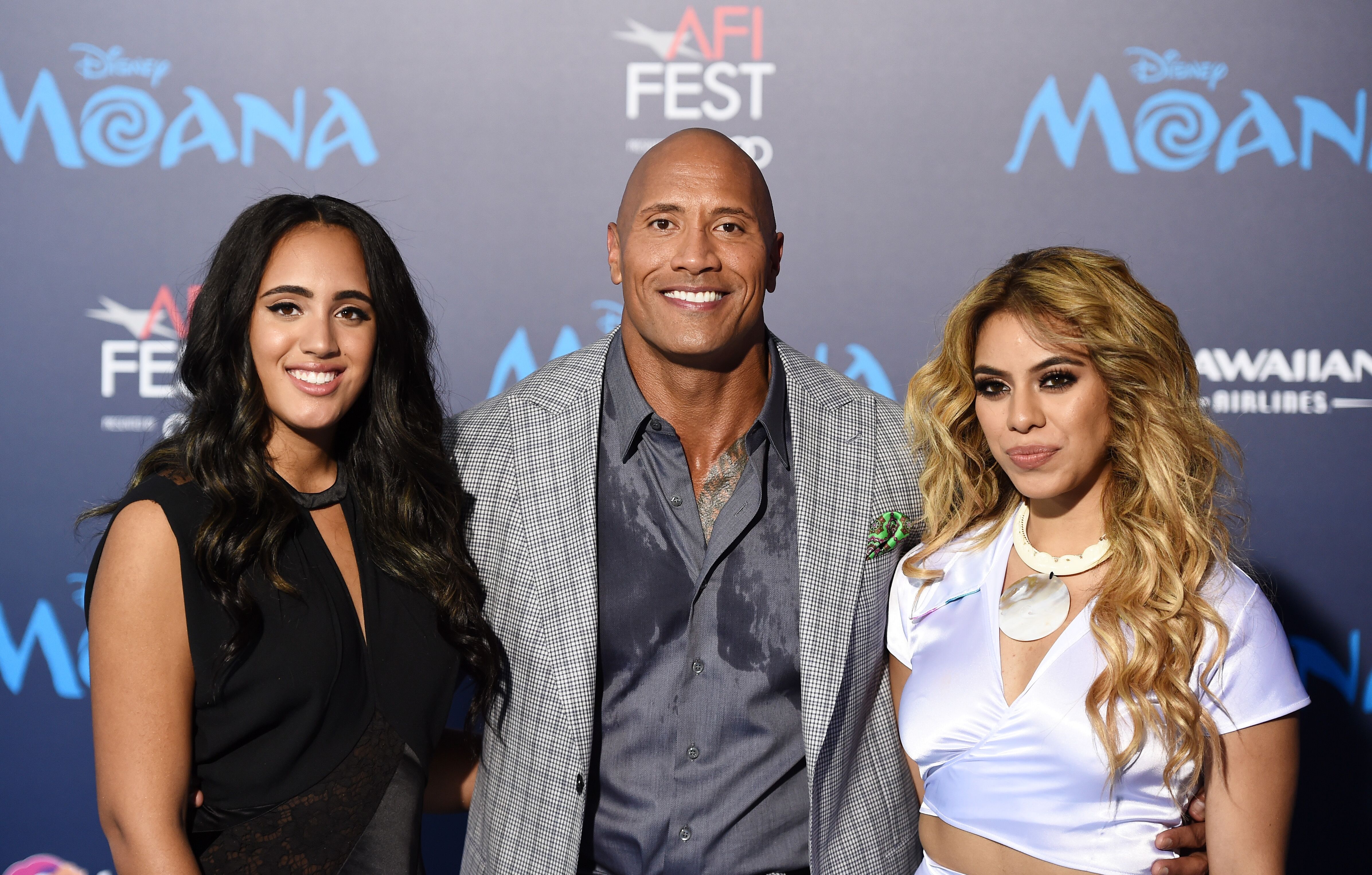 HOLLYWOOD, CA - NOVEMBER 14: (L-R) Simone Alexandra Johnson, actor Dwayne Johnson and singer Dinah Jane Hansen arrive at the AFI FEST 2016 Presented By Audi premiere of Disney's "Moana" at the El Capitan Theatre on November 14, 2016 in Hollywood, California. (Photo by Amanda Edwards/WireImage)