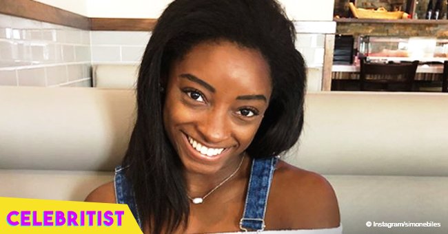 Simone Biles flaunts her toned abs and legs in sports bra and tiny shorts