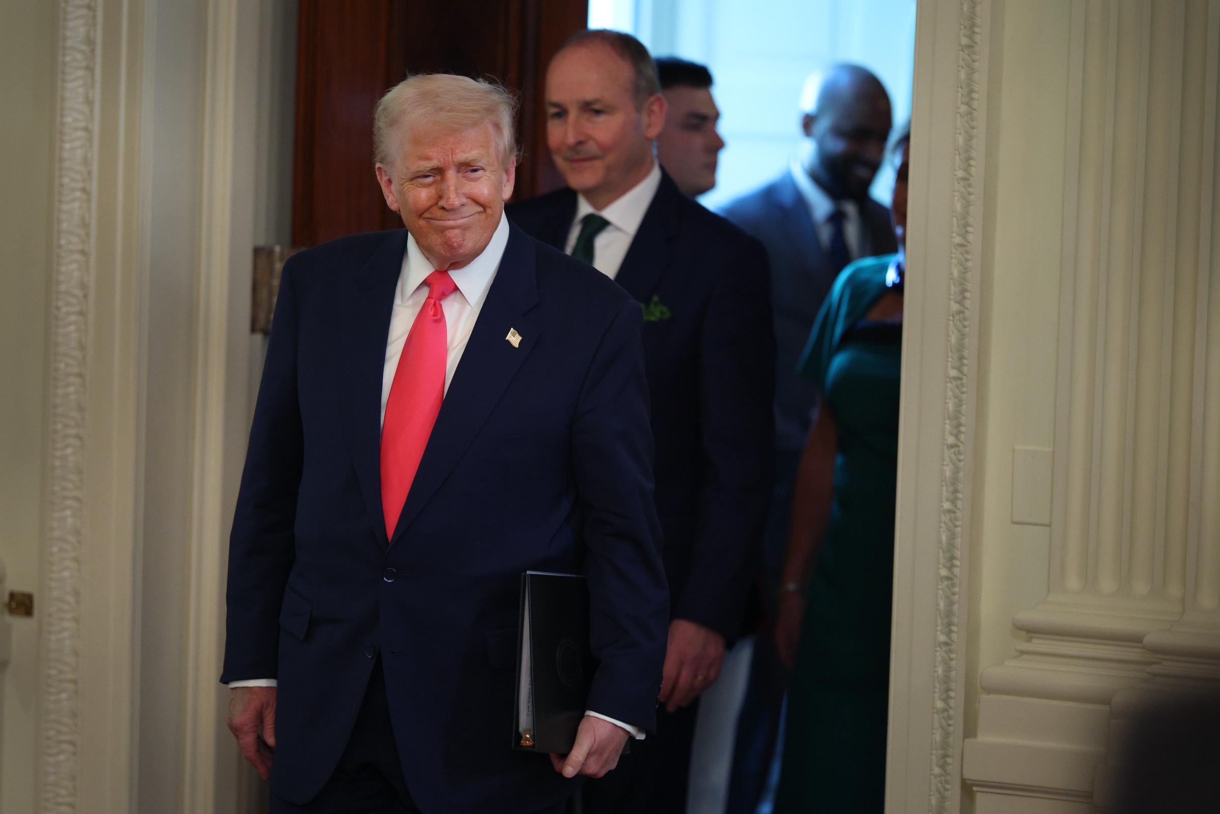 U.S President Donald Trump arrives for a St. Patrick’s Day event with Irish Taoiseach Micheál Martin in the East Room of the White House on March 12, 2025, in Washington, D.C. | Source: Getty Images