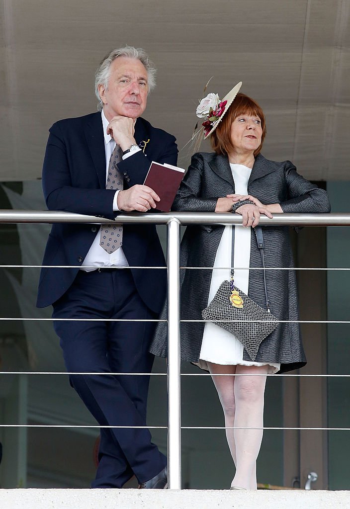 Alan Rickman and wife Rima Horton attend on day two of the Qatar Goodwood Festival at Goodwood Racecourse on July 29, 2015 in Chichester, England | Photo: Getty Images