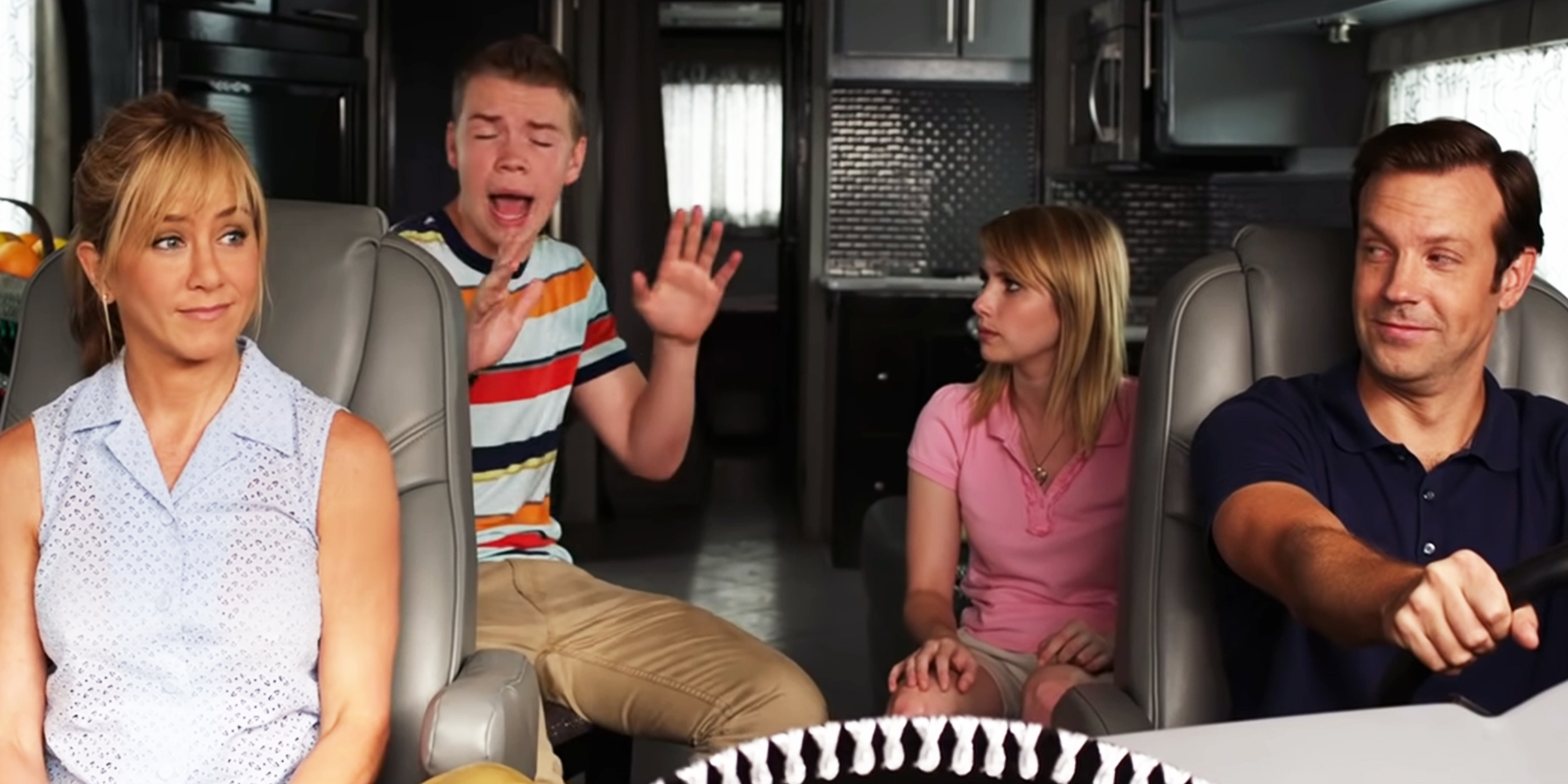 A movie still from "We’re the Millers," 2013. Front: Jennifer Aniston and Jason Sudeikis, back: Will Poulter and Emma Roberts | Source: Youtube.com/WarnerBros.Pictures