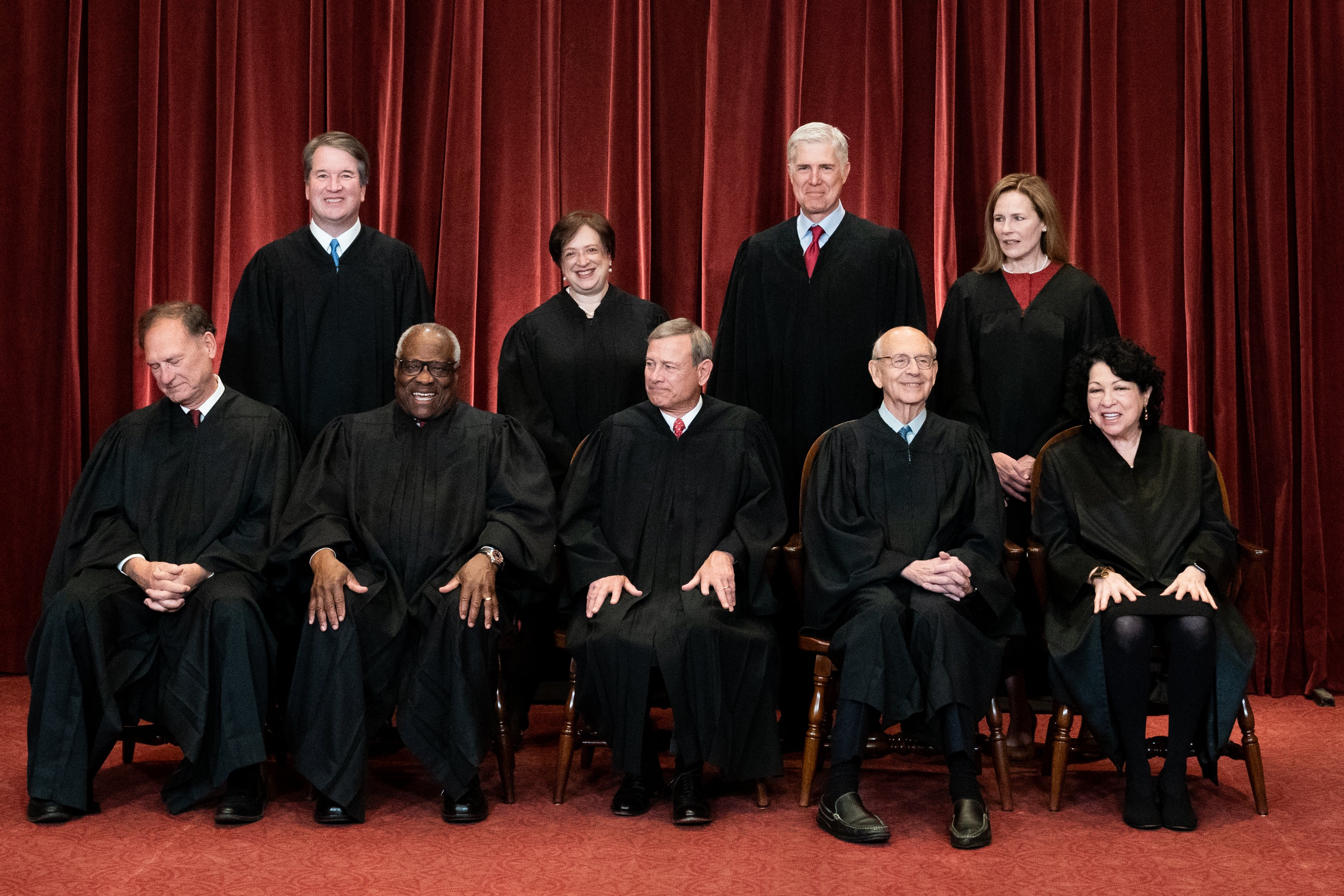 Members of the Supreme Court pose for a group photo at the Supreme Court in Washington, DC | Source: Getty Images