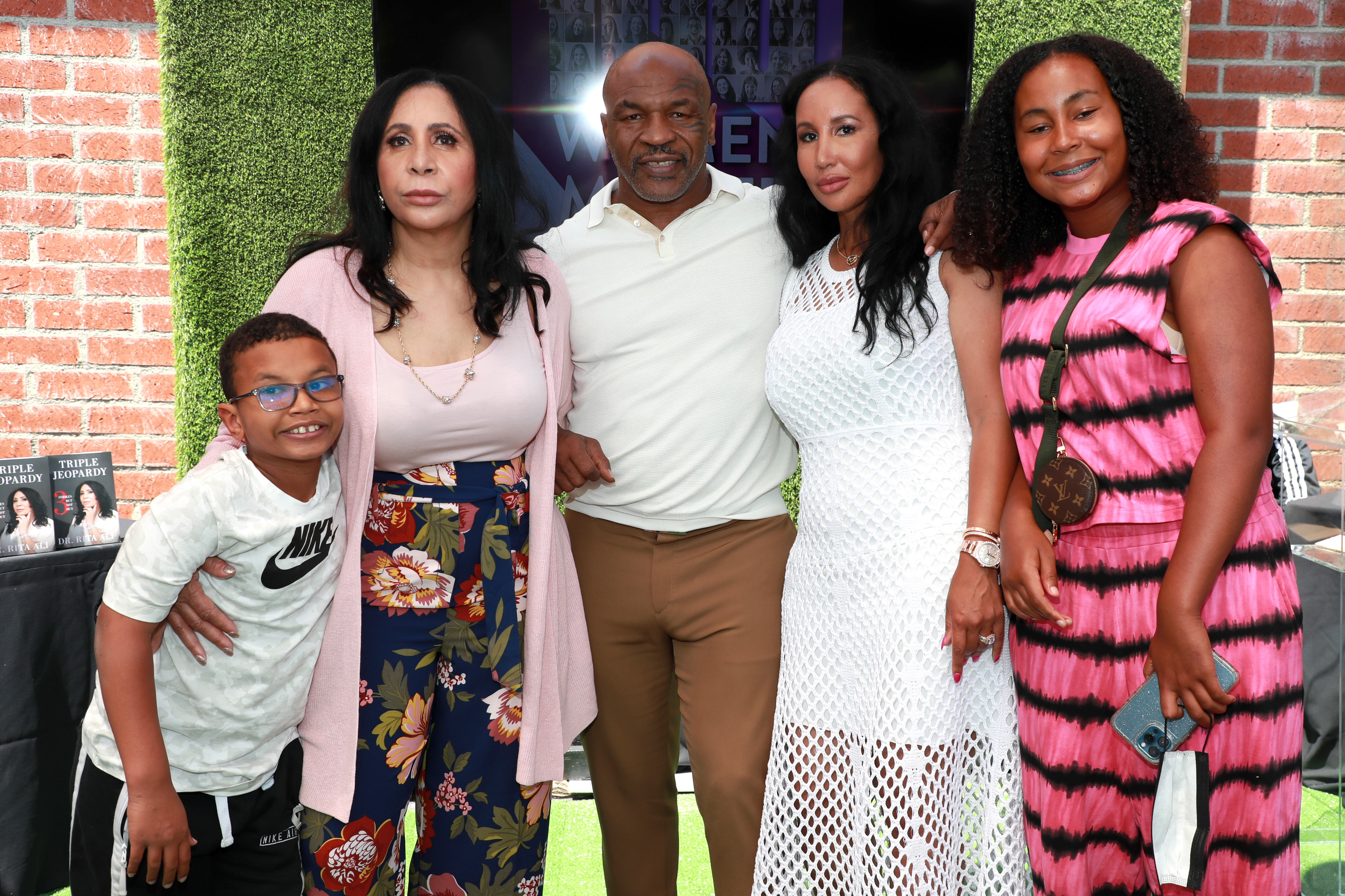 Mike Tyson, alongside his son Morocco, mother-in-law Rita Ali, wife Lakiha "Kiki" Spicer, and daughter Milan Tyson, at the 100 Women Matter Luncheon on May 8, 2021, in El Segundo, California | Source: Getty Images