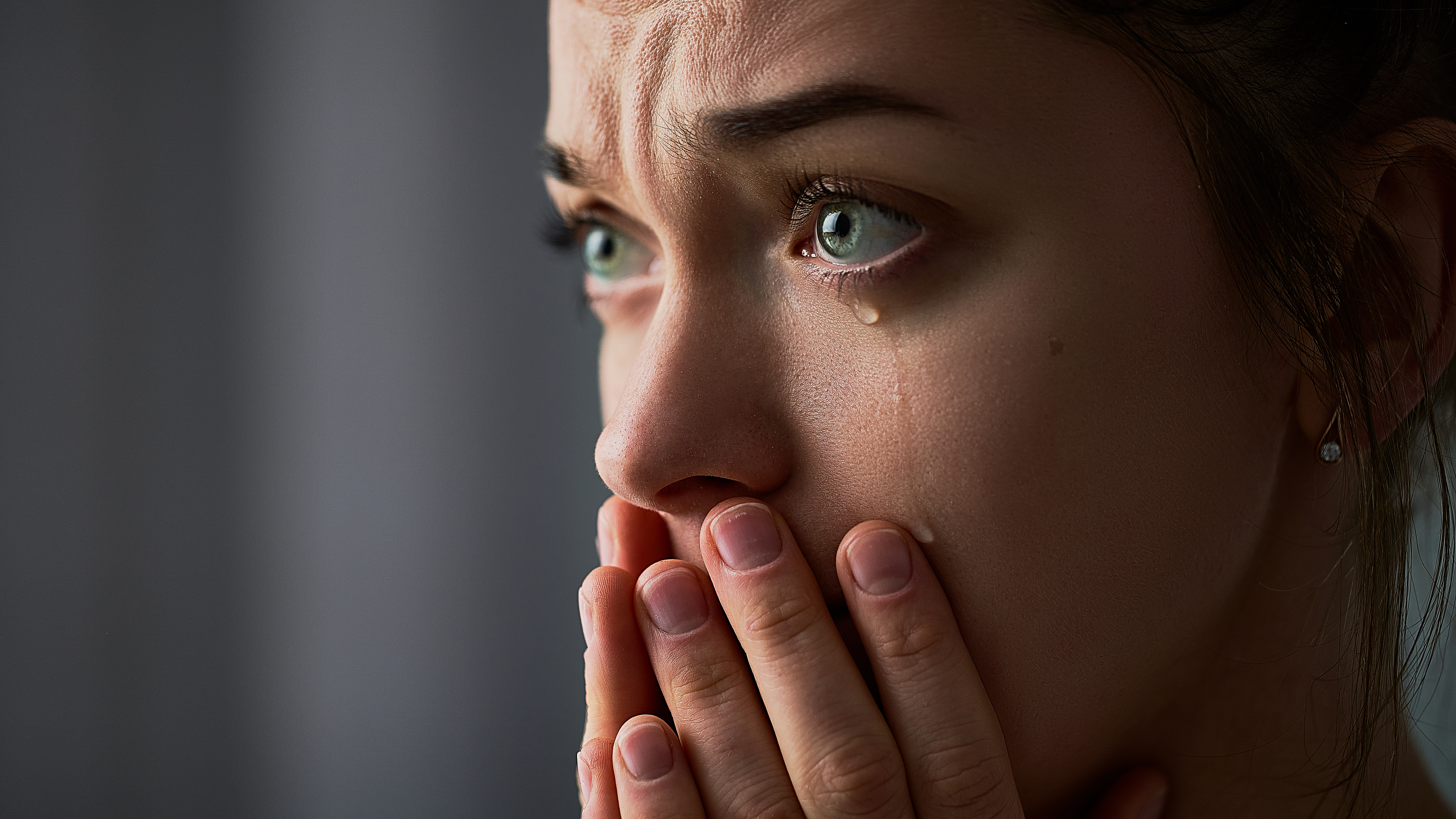 Close-up of a woman crying | Source: Shutterstock