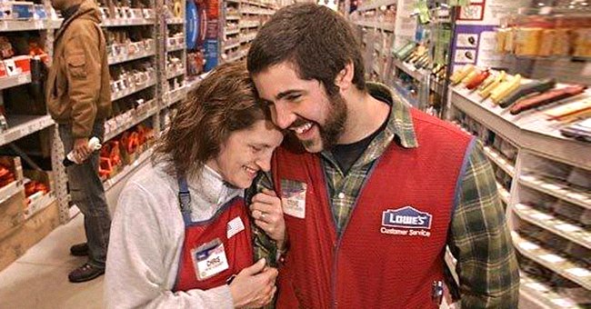 Christine Tallady lovingly leans on her biological son, Steve Flaig's shoulder inside the Lowe's store where they worked. | Source: twitter.com/ArrajolM