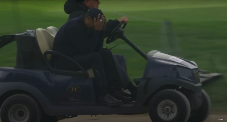 Tiger Woods being escorted off the golf course at The Genesis Invitational event posted on February 17, 2024 | Source: YouTube/Golf Channel