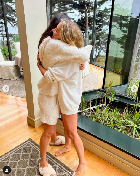 Hayley Erbert and Julianne Hough sharing a hug posted on December 21, 2023 | Source: Instagram/juleshough