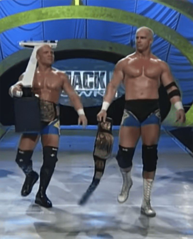 On-stage wrestling cousins Hardcore and Crash Holly walking toward the ring for a match with mankind and Al Snow in November 1999. I Image: YouTube/ WWE.