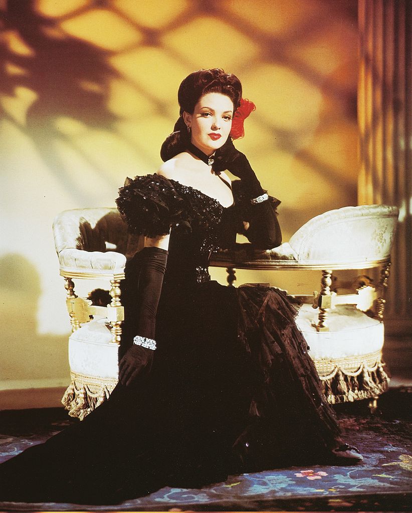 US actress Linda Darnell in a studio portrait, against a yellow background, circa 1950. | Photo: Getty Images