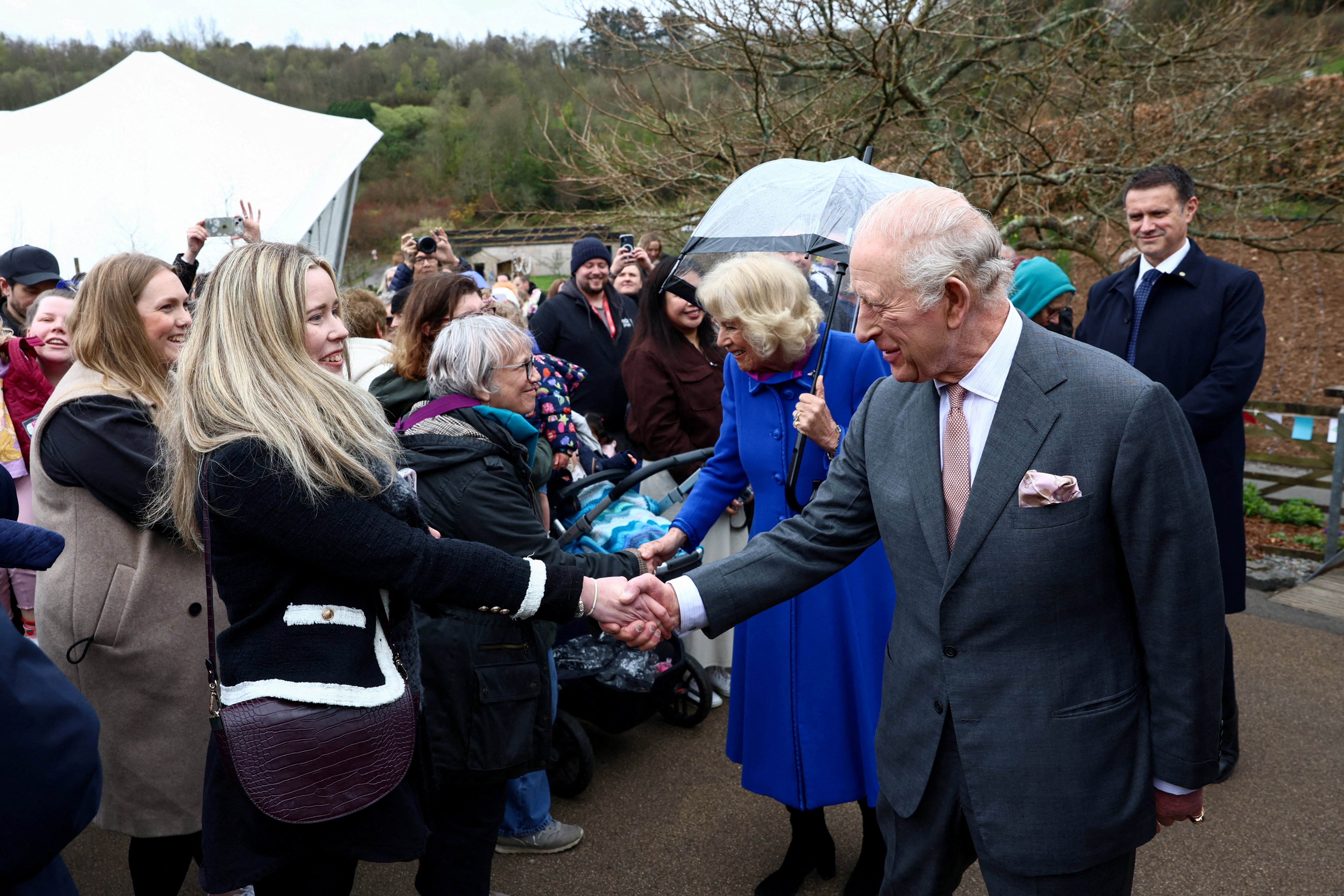King Charles III and Queen Camilla greet visitors during an event to mark the 25th anniversary of The Eden Project in Bodelva on 24 March 2026 in Cornwall, England. | Source: Getty Images