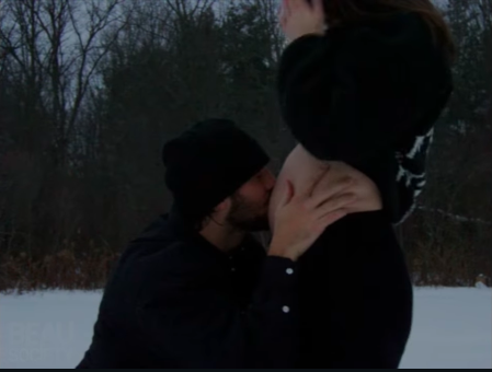 Josh Allen gently kissing Hailee Steinfeld's baby bump in their pregnancy announcement video, posted on December 13, 2025. | Source: Instagram/haileesteinfeld and joshallenqb