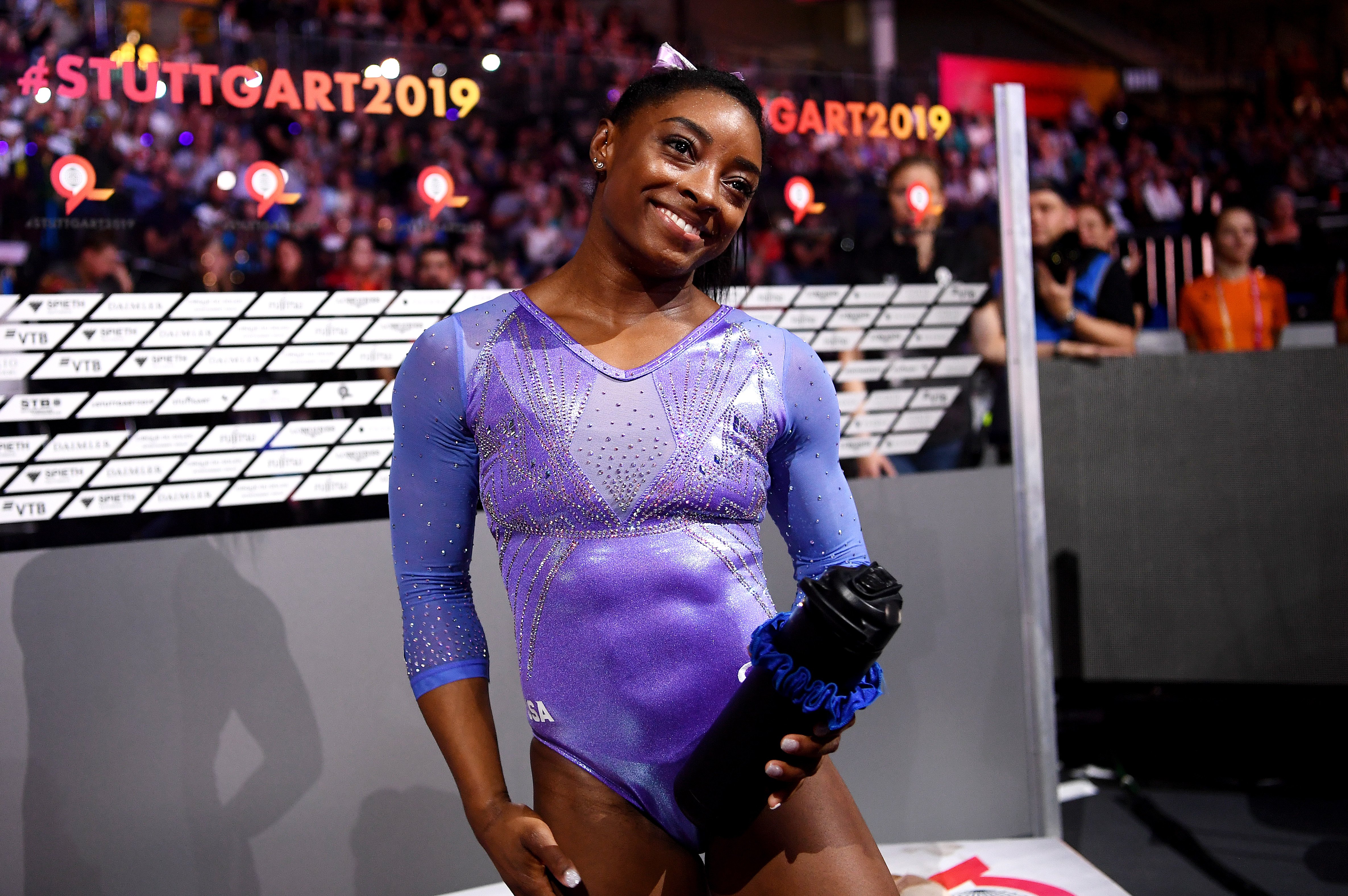 Simone Biles celebrates winning gold in the Women's Floor Final during day 10 of the 49th FIG Artistic Gymnastics World Championships on October 13, 2019 in Stuttgart, Germany. | Photo: Laurence Griffiths/Getty Images