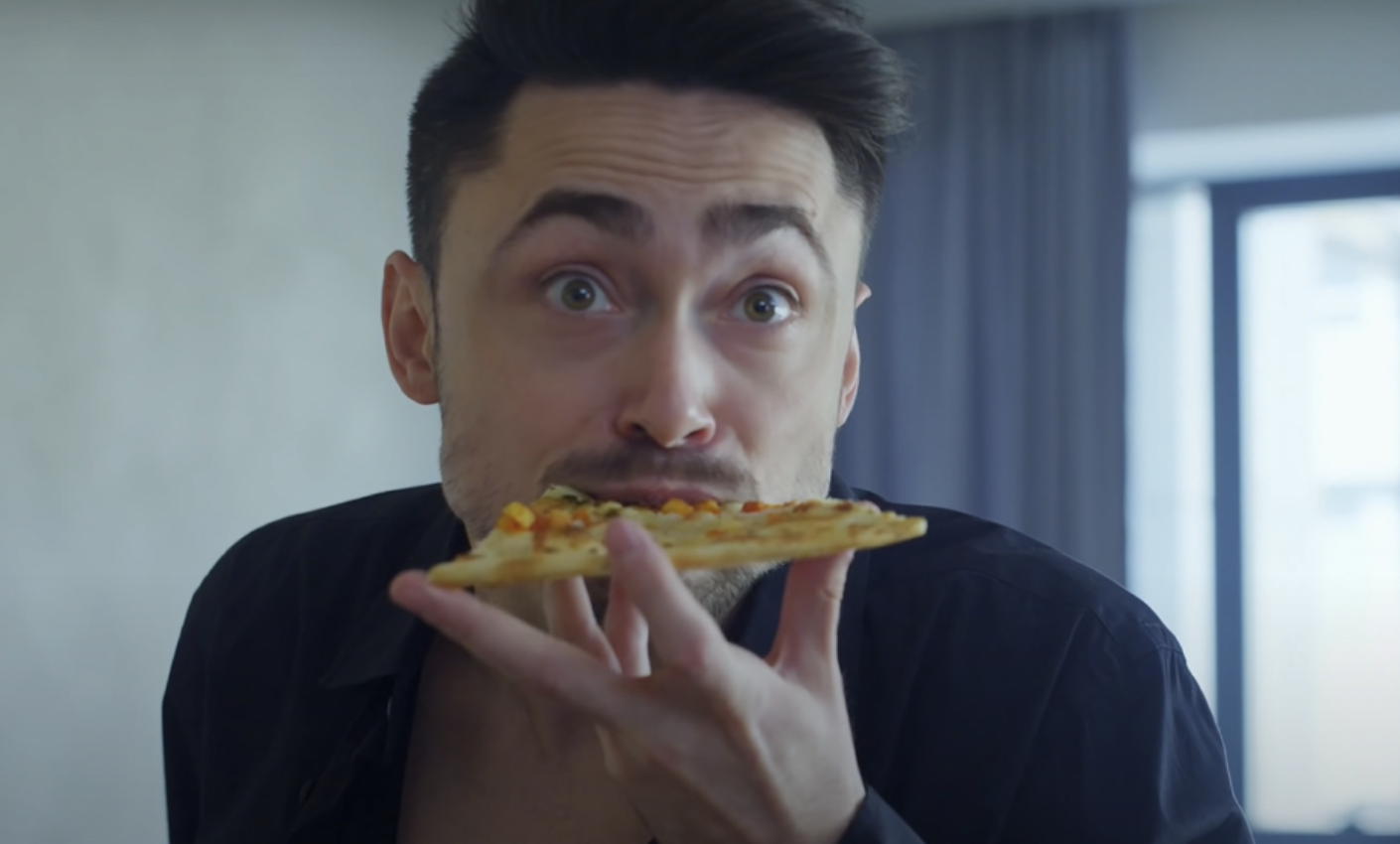 Man eating pizza | Source: YouTube / DramatizeMe