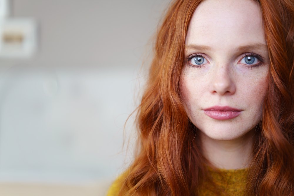 A girl with red hair and blue eyes. | Photo: Shutterstock
