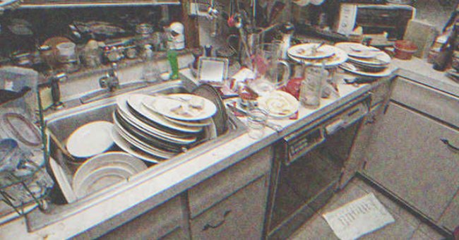 A pile of dirty dishes on a kitchen | Source: Shutterstock