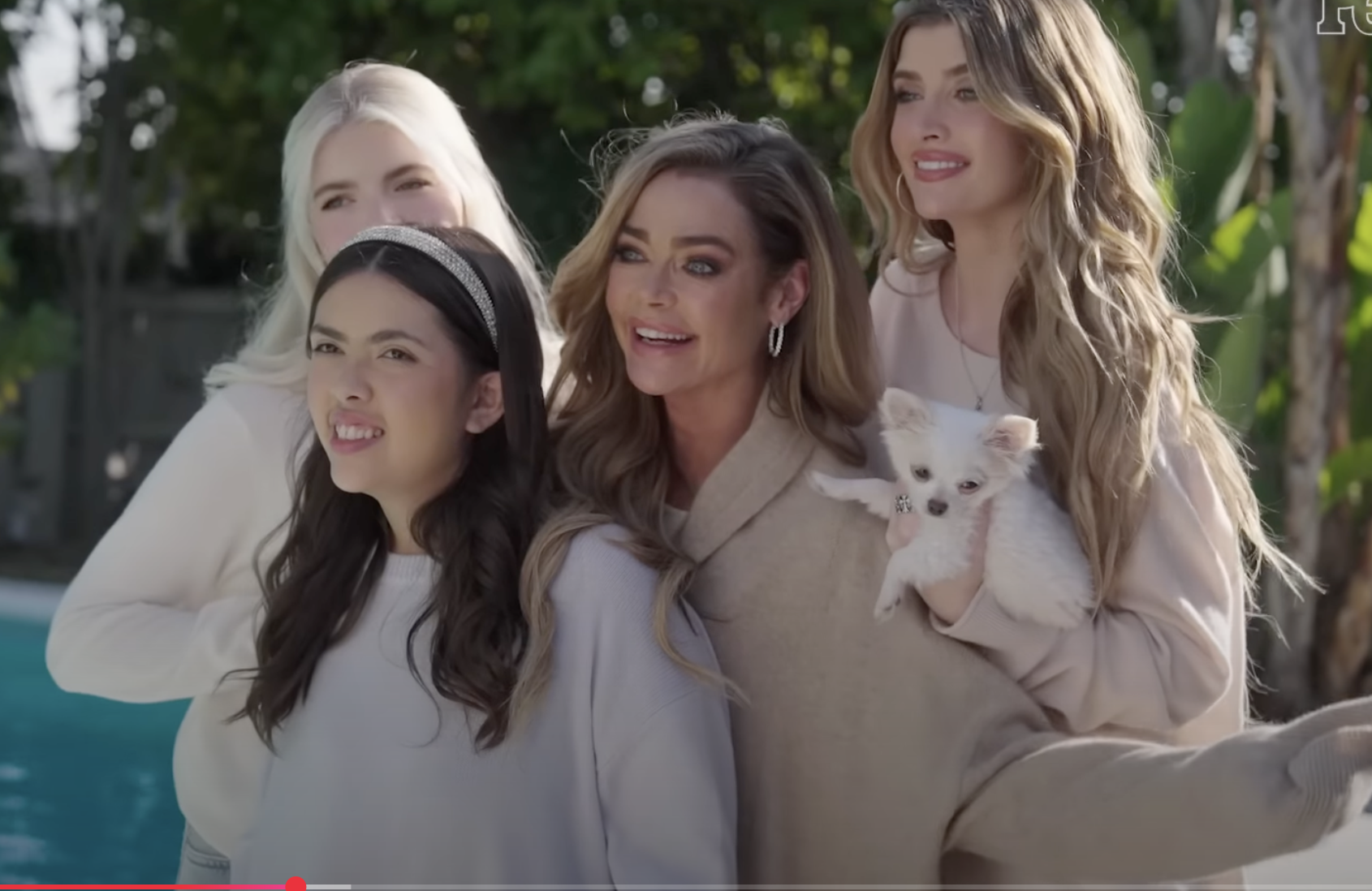 Eloise and Denise Richards smiling for photos with Lola and Sami Sheen, and their dog. | Source: YouTube/People